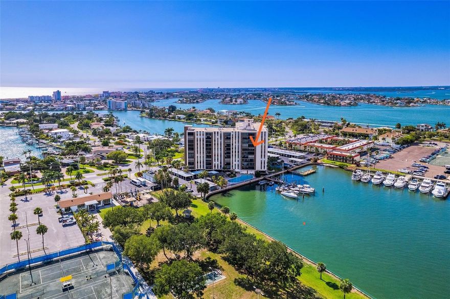 Welcome to Paradise Island Towers Condominium unit 608, ideally located on Paradise Island in Treasure Island and surrounded by beautiful waterfront homes and residences. This spacious two-bedroom, two-bath corner unit offers over 1,100 square feet of living space and showcases sweeping water views with both easterly and northwesterly exposures.
Enjoy serene harbor views from your privately screened balcony, where sailboats glide by and dolphins are often seen playing in the water. The open floor plan is enhanced by gleaming terrazzo floors, a freshly painted interior, and a refreshed, updated kitchen with breakfast bar. Additional upgrades include new ceiling fans, updated hardware, and new bathroom vanities and lighting. The 2 spacious bedrooms feature gorgeous views, new windows and window treatments. The master bedroom offers an on-suite bathroom.   Just off the kitchen area there is a walk-in pantry for added storage.  
This residence also includes hurricane shutters; an extra-large private storage space and trash chute located on the same floor.  Sought after under-building parking conveniently located just outside the lobby entrance, where you will be greeted by your doorman during business hours.
Paradise Island Towers offers exceptional amenities, including a heated waterfront pool and spa, gas grilling stations, and inviting patio areas perfect for relaxing or entertaining. Residents enjoy access to a fishing dock, boat slips, and abundant guest parking. Ideally situated, you are just a short walk or bike ride to the beach, as well as nearby shops, dining, and entertainment.
This well-maintained community also a mailroom for all your package deliveries, on-site property management, and the ease of secure, comfortable condominium living—all in one of Treasure Island’s most desirable waterfront settings.
Located next door to the Paradise Island Community Center, residents can take advantage of scenic waterfront walking paths, gazebos, and recreational facilities including volleyball, basketball, tennis, and pickleball courts.  Paradise Island Towers offers easy access to St. Pete Clearwater Airport, Tampa International, Clearwater and Sarasota.