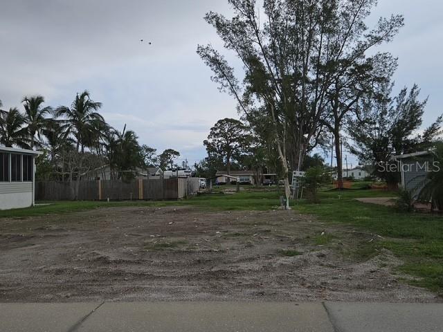 Here is your opportunity to own in Paradise Bay, a vibrant, active 55+ community. This larger-than-average lot provides the perfect canvas for a well-appointed, spacious mobile or manufactured home, ideally situated 2 blocks from Sarasota Bay. Enjoy breathtaking sunsets from the bayfront. This friendly community boasts an array of amenities including a clubhouse, swimming pool, shuffleboard, tennis, bocce ball, and community boat ramps. With golf carts as the main mode of transport, you'll love the convenience and active lifestyle. There are numerous clubs and activities for you to be as busy as you like. Just minutes from Anna Maria Island, you'll have easy access to beaches, dining, and shopping. There is also a marina with boat slips & docks available for rent, there is a waitlist. Embrace low-maintenance living in a community where neighbors truly become family!