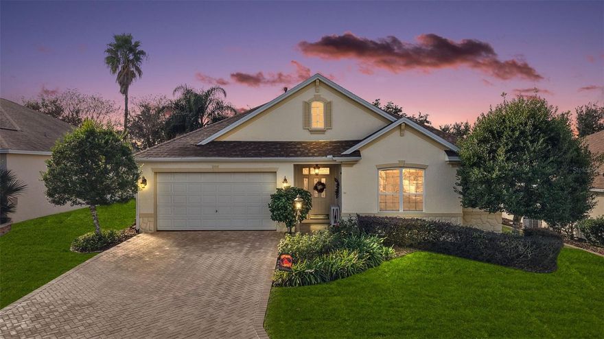 FABULOUS 3/2.5 Bridgeport with an EXPANSIVE 23’ x 19’ FLORIDA ROOM and rear PAVER PATIO with PERGOLA and PRIVACY landscaping in the highly desirable Village of Largo! JUST MINUTES to Lake Sumter Landing! BOND PAID! NEW ROOF (2025), HVAC (2022), and Tankless HWH (2020). MATURE  landscaping, PAVER walk and driveway, COVERED vestibule, and entry door with LEADED-GLASS sidelight and transom window welcome you in to the SPACIOUS foyer. The STUNNING kitchen showcases a generous CENTER ISLAND and POT RACK, staggered WHITE SHAKER cabinetry with PULL-OUTS, VEINED QUARTZ countertops, TILED backsplash, STAINLESS appliances, built-in PANTRY, GAS cooking, DESK area, and an EAT-IN breakfast bar and additional DINETTE for casual dining. The ELEGANT living room features a TRAY ceiling and RICH WOOD LAMINATE floors which seamlessly flow into the FORMAL dining area featuring a BAYED wall with four large windows for an ABUNDANCE of NATURAL LIGHT. Upgrades include CROWN MOLDING and HIGH BASEBOARDS that adorn the ENTIRE home. A SPECTACULAR rear FLORIDA ROOM adds approximately 437SF of under-air living space and features TILE flooring, HIGH ceilings, a plethora of windows, and exterior French door leading to the rear PAVER patio with decorative PERGOLA and PRIVACY landscaping. Back inside, DOUBLE doors welcome you in to the luxurious primary bedroom, where you'll find RICH WOOD laminate flooring, TRAY ceiling, an abundance of windows, and an ENORMOUS CUSTOMIZED WALK-IN closet with divided his and hers sides. Its en-suite bathroom features TILE flooring, HIGH ceilings, WHITE cabinetry, VEINED QUARTZ countertops, DOUBLE vanities, make-up area, built-in LINEN closet, TILED ROMAN STYLE WALK-IN shower, and a separate water closet. Two additional bedrooms and a second bathroom are conveniently located near the front of the home ensuring plenty of PRIVACY for guests or home office. Both bedrooms feature LAMINATE floors and built-in closets. The third bedroom also offers DOUBLE windows and CUSTOMIZED BUILT-IN desk and cabinetry. The second bathroom lies between these two bedrooms in Jack-and-Jill style. It offers a TILED floor, WHITE vanity with VEINED QUARTZ top, and a TILED tub and shower combination. There’s also an ADDITIONAL HALF BATH hidden behind a POCKET DOOR near the foyer. An INTERIOR laundry room features TILED floors and WHITE cabinets. It leads to the 2-CAR GARAGE with a utility sink, attic access with stairs, and PLENTY of room for parking and storage!  DON’T MISS YOUR OPPORTUNITY TO OWN THIS INCREDIBLE HOME! The Village of Largo is nestled in the heart of The Villages between Lake Sumter Landing and Brownwood Paddock Squares; close to Havana and Mallory Hill Championship Golf and Country Clubs; Bacall, Canal Street, and Colony Cottage Recreation Centers; Hadley, Amelia, and Largo Pools; several other pools and pickle ball courts; and CR466A with an abundance of shopping, restaurants, banks, medical and more! PLEASE WATCH OUR WALKTHROUGH VIDEO OF THIS MAGNIFICENT HOME and CALL TODAY for your private showing or virtual tour!
