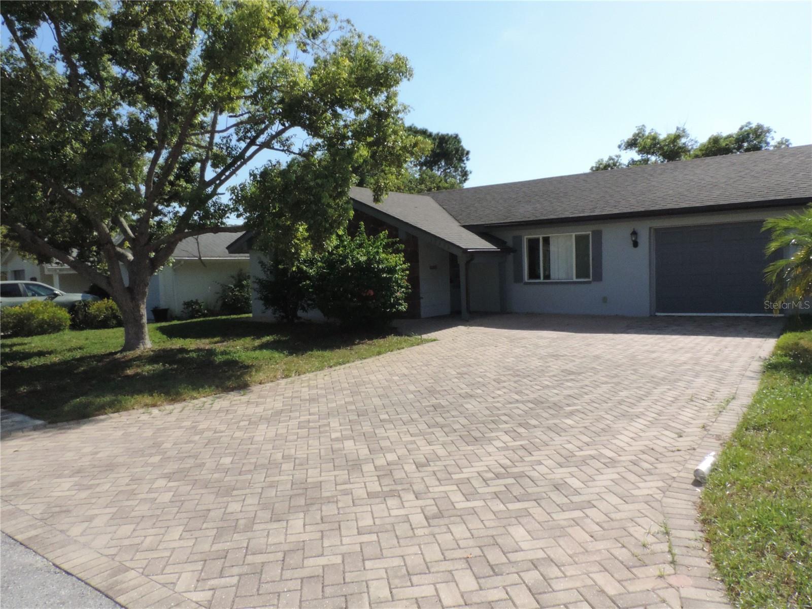 Spacious 2 bedroom, 2-bathroom, 1 car garage home on 1/3-acre lot WITH views of the Bear Creek Canal. This open floor plan home features both a living room and family room AND BONUS room! Primary bedroom with walk in closet and en suite bathroom. Kitchen is light and bright with breakfast bar opening into the dining area. The oversized backyard has matured landscaping and unobstructed views of the canal. A little TLC can transform this hidden gem into your dream home. The community of Beacon Woods Village offers tennis courts, community pool, shuffleboard, basketball court, bocce court, horseshoe pits, billiard room, fitness center, an 18-hole golf course, and clubhouse. Roof 2019, Air conditioning 2018. Stabilization/Remediation Complete 2009.