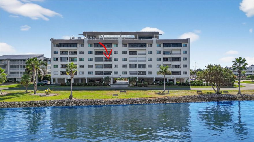 Open the door and say “WOW!”  Enjoy breathtaking views of Charlotte Harbor from this beautifully updated condo on the 4th floor.  Furnished TURN-KEY! (just bring your toothbrush) Resort-style amenities include a rooftop pool and clubhouse, a relaxing sauna, and easy access to the vibrant lifestyle of Punta Gorda.  Convenience is key with your assigned covered parking spot (4E) with a large storage unit that's wide and deep enough for two bicycles.  In this unit, all windows and the sliding glass door have been replaced with IMPACT resistant glass, complemented by a remote-controlled hurricane shutter for added security. No closed-off kitchen here--a major remodel completely reconfigured the kitchen so that the open floorplan flows easily and allows more enjoyment of the gorgeous water view.  High end custom maple cabinetry and granite countertops were installed.  The remodel included TILE flooring throughout (no carpet!); modern lighting fixtures; updated bathrooms with tile showers; new sinks and toilets; and a granite vanity in the master bathroom.  Recent upgrades within the past five years include a new HVAC system, air handler, and thermostat; new water heater; and a new dishwasher. A NEW ROOF is currently being installed, and the security system at the lobby is being upgraded for your peace of mind. Each floor has its own laundry room and trash chute, plus this unit has hookups for a washer and dryer in the hall closet. Imagine the convenience of being the closest to the elevator and sitting area on the balcony, yet tucked away for privacy.  Fisherman's Village Pier, Sunseeker Resort, lively downtown, and waterfront dining are close enough to enjoy everyday.  Don't pass up the opportunity to own a move-in-ready home with stunning views and top-notch amenities in one of Florida’s most desirable waterfront communities.