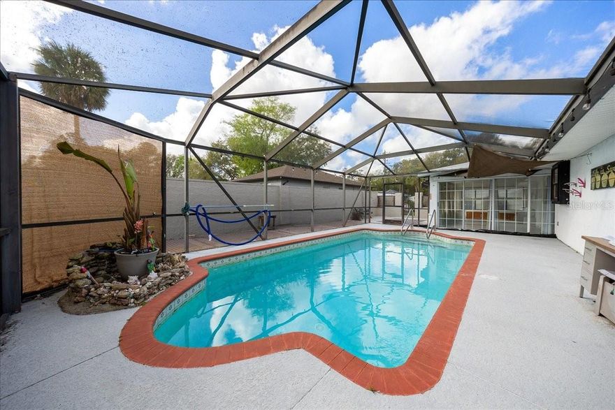 Does your home have an inground pool?   This pool home offers a great opportunity for buyers who want a property they can personalize. Homes with private pools continue to draw strong interest, and this one provides the foundation buyers look for—an established neighborhood, a functional layout, and a backyard centered around the pool. The home does need updates, making it ideal for someone who wants to choose their own finishes and create a space that reflects their style. With solid bones and plenty of potential, this property is ready for a buyer who can see the value in making it their own. Come take a look and imagine how you would transform it. This is a 2 bedroom but the lania could easily become a bonus room, office or 3rd bedroom!  Come see today!  Close to the Silver Springs Park this home is sure to please. The 3 car garage offers tons of storage and the fenced in yard is a huge plus!!