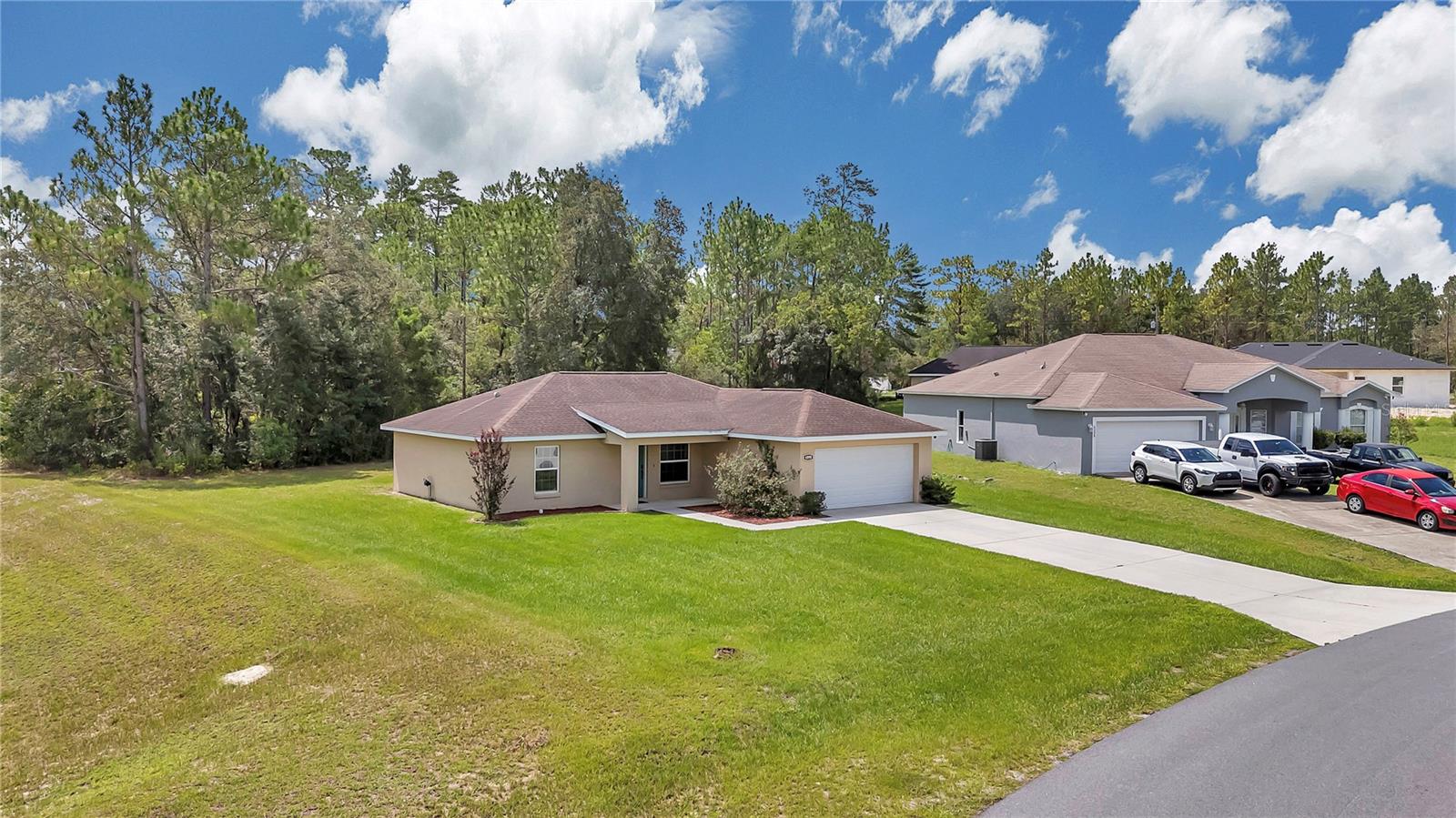 Welcome to this stunning open-concept three-bedroom, two-bathroom home, ideally situated on nearly half an acre in the serene surroundings of beautiful Ocala. This thoughtfully designed residence features a desirable split floor plan, ensuring privacy and comfort for everyone. The master includes its own spacious bathroom with double sinks and walk-in closet. The indoor laundry room adds to the convenience of day-to-day living, while the seamless flow of the open floor plan creates an inviting atmosphere for family gatherings and entertaining. Enjoy the tranquility of having no neighbors behind or to the left, allowing you to embrace the beauty of nature from your own backyard. This peaceful neighborhood offers the perfect balance of modern convenience and natural charm, making it an ideal place to call home. Come discover your own slice of paradise!