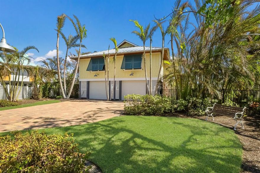 241 Waterways Avenue was renovated in 2014 with a new standing seam metal roof with foam insulation, hardi-plank siding, tongue and groove solid soffits and all impact doors and windows. This elevated cottage on the Waterways Canal offers 112 feet of seawall frontage with deepwater dockage and a lift. Beautiful tropical landscaping surrounds this three bedroom and two bath home that also features an elevator. Architectural elements include half-round gutters and shake style cement board siding. So greatly sought after and so rarely offered, this property has abundant dockage with quick access to Charlotte Harbor and the Gulf of Mexico making it a boater’s dream. Combine this benefit with its' convenient location in the Village of Boca Grande, just a short walk or golf cart cart ride to our Island restaurants, shops and beaches, and you have a real Boca Grande gem! Spend the evening on the spacious rear screened porch enjoying tropical breezes and watching lazy manatees cruise the Waterways Canal. The home features an open floor plan perfect for entertaining your guests and family. The hardscaped ground level also offers abundant outdoor living space with seating, loungers and a portable fire pit which sets the mood for you and your guests. There are two automatic garage doors that enclose spacious parking for both cars and golf carts. There is also enclosed, lockable storage space on the ground level to secure bicycles, boating gear and your beach set up. This is your opportunity to live in the Village and have your boat in your back yard canal. 241 Waterways is a must see!
