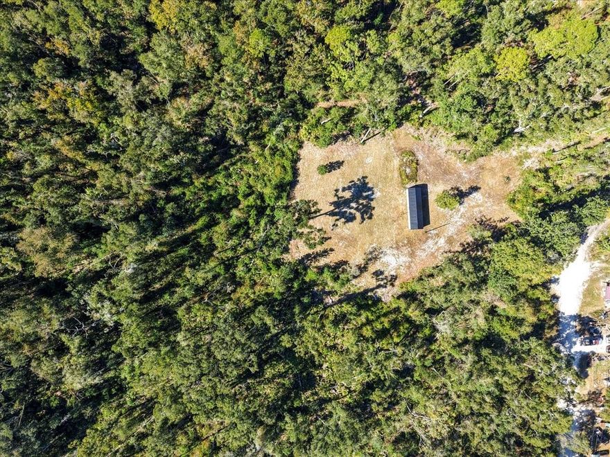 2.77 acres build-ready land cleared with septic system pumped & active, private well, electric pole and current survey available.