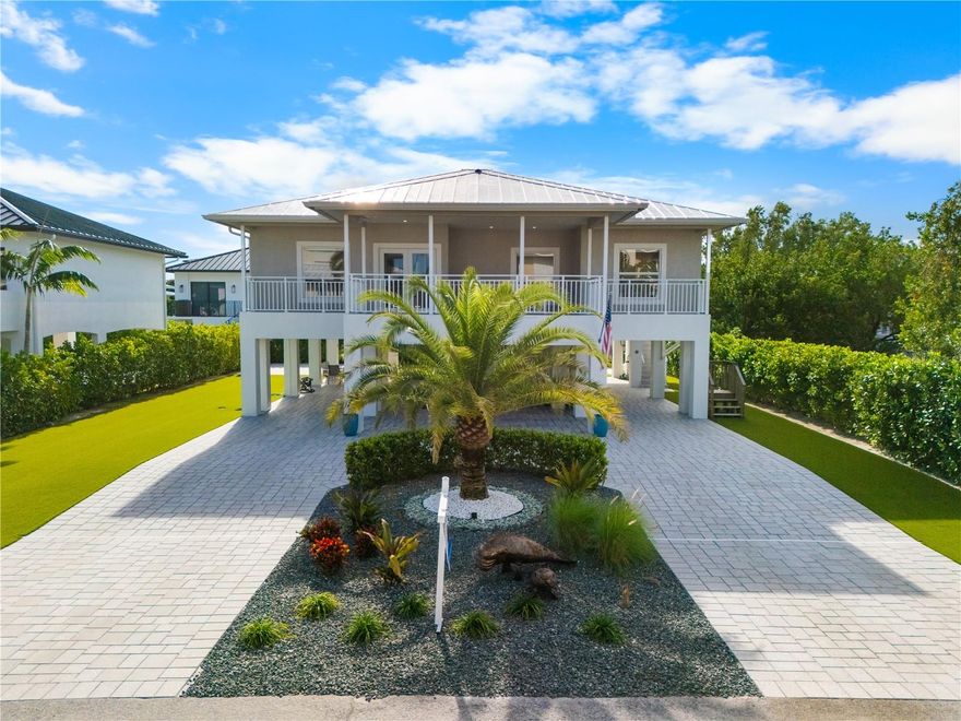 Located in the heart of Duck Key, this 4-bedroom, 3-bath home offers flexible living space, a practical layout, and a property configuration that provides additional side-yard space—ideal for those seeking room for a boat, trailer, or RV. With 1,960 square feet of interior living space, plus an additional 300 square feet of ground-level storage, the home is well suited for full-time living, a second home, or an island retreat. The floor plan features two primary bedrooms, each with its own private bathroom, offering excellent flexibility for hosting guests or multi-generational living. Inside, the layout is bright and functional with well-proportioned rooms and multiple living areas, while the ground-level storage is perfect for kayaks, bikes, fishing gear, and all your Keys essentials.Just down the street from Duck Key Marina, residents enjoy convenient access to boat storage, dockage, fuel, and marine services, all within one of the Middle Keys’ most desirable communities known for its relaxed lifestyle and island charm.