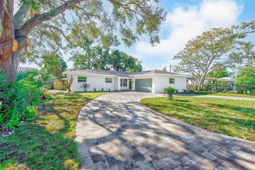 Introducing this gorgeous, fully-renovated home located on a quiet street just 10 minutes from downtown St Pete and our award-winning beaches! This property is located in a NON-flood zone, providing plenty of peace of mind. This beautiful home features a long list of upgrades, including its brand new paver driveway (2025), new electrical panel & meter (2025), new hurricane-rated windows (2025), and a new garage door opener.  Inside, the home has been completely updated with new luxury vinyl plank flooring throughout, both bathrooms fully renovated, and a modern kitchen showcasing quartz countertops, ample cabinetry, and a custom dry bar that's perfect for entertaining.  Additionally, the home's major systems are in great condition, with a 2019 AC with all new ductwork and returns, and a 2015 roof! Look no further than this move-in ready gem with quality upgrades throughout and an unbeatable location close to downtown, beaches, and plenty of shopping and dining.  Call today to schedule your private showing!
