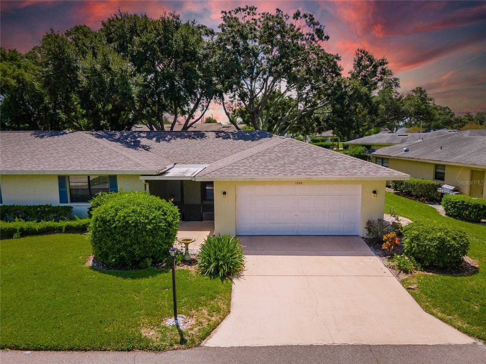 One or more photo(s) has been virtually staged. Welcome to your dream home in the highly sought-after 55+ gated golf cart community of Kings Point, where resort-style living meets comfort, charm, and value! This move-in ready 2-bedroom, 2-bathroom home with a 2-car garage has been beautifully renovated and is ready for its new owner. Enjoy one of the best curb appeals in the community with lush landscaping that leads to a spacious, screened, and covered front porch – perfect for your morning coffee or relaxing with a good book. Step inside and be greeted by an open concept great room and dining area filled with natural light and elegant finishes, featuring luxury vinyl wood plank flooring, fresh paint, and stylish fixtures throughout. The kitchen is a chef’s delight with custom wood cabinets, gold hardware, butcher block countertops, a custom backsplash, a large pantry for all your storage needs, and brand new stainless steel appliances that have never been used. The grand owner's suite offers a peaceful retreat with a wall of continuous closets, plenty of space for your king-sized bed and large furniture, and a renovated en-suite bathroom with dual vanities and a custom-designed shower for ultimate privacy and comfort. The guest bedroom is bright and spacious, the guest bath has also been completely renovated, making your friends and family feel right at home. Additional features include an inside laundry room with utility sink and cabinetry, ample storage closets, and a beautiful backyard with luscious common areas perfect for enjoying Florida’s year-round sunshine. The A/C is from 2017 and the roof was replaced in 2021 for added peace of mind. Kings Point offers over 200 clubs and activities, two stunning clubhouses, an 850-seat Veterans Theater, 6 heated pools, spas, hot tubs, tennis courts, pickle-ball courts, billiards, 3 golf courses, and state-of-the-art fitness centers. Your monthly fee covers cable, internet, water, trash, sewer, exterior insurance, lawn care, pest control, security, and so much more, making life truly maintenance-free. Sun City Center has everything you need from doctors and shopping to restaurants and entertainment, with quick access to beautiful beaches, Tampa International Airport, MacDill AFB, Sarasota shops, Ellenton Prime Outlets, and even Disney World. Bring your offers, don’t miss your chance to own this stunning, turn-key home in one of Florida’s best active communities. Schedule your private showing today and start living your best life at Kings Point!