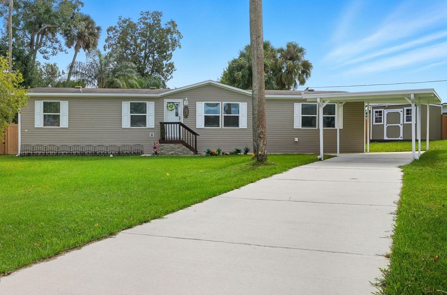Own the Land – No Land Lease! This stunning 2021 home is completely updated and move-in ready! Enjoy peace of mind with NO CDD fees, NO flood history, and a superior community drainage system—all for just $15/month HOA.

Located minutes from world-famous Daytona Beach and the Daytona International Speedway, this spacious home sits on a large 1/3-acre lot and features 3 bedrooms, 2 full bathrooms, and two oversized living areas perfect for entertaining. The modern kitchen boasts updated finishes, while new light fixtures throughout the home add a fresh, contemporary touch. The primary suite includes a walk-in closet and a beautifully upgraded bathroom.

Outside, enjoy great parking with an oversized driveway, a large flat front yard, and a fully fenced backyard—ideal for pets, family gatherings, and privacy. A large storage shed provides extra space for tools or outdoor gear.

This like-new home combines comfort, style, and unbeatable location—close to beaches, parks, shopping, dining, and family fun. Experience easy Florida living in this beautifully updated Daytona Beach retreat!