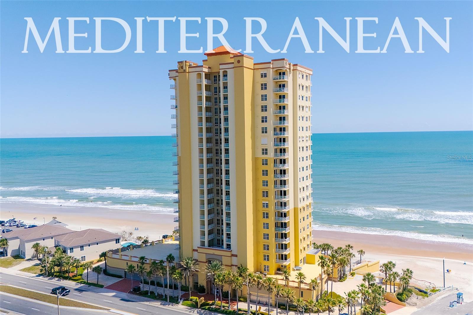 *Condo fees paid in full through 2025!* Serene, southeast-corner oceanfront living can be yours from this rarely available luxury condo at the Mediterranean in Daytona Beach. Breathtaking beach views are afforded by an array of perfectly-placed windows and the sprawling oceanfront balcony. As you enter through a formal foyer, behold large living areas, appointed with wood flooring and crown molding, that overlook the brilliant blue Atlantic coastline. The open kitchen is perfect for meal prep, providing ample cabinetry, gorgeous granite counters, and stainless steel appliances. Entertain friends and family in the large gathering room, enjoy beachfront dining, and retreat for breezy evenings on the balcony - what could be better! The primary suite boasts direct balcony access and a primary bathroom which features a dual vanity, walk-in shower, and a relaxing jetted tub. Also take note that while this condo is on the second residential floor, because of the garage and common area levels, the unit actually sits on the fourth story, allowing for better views and more privacy than typical second floor condos. At Mediterranean residents enjoy a brilliant beachside lifestyle bolstered by an oceanfront swimming pool, fitness areas, direct beach access, secure parking, and secure, private access to each floor. Don’t miss out on this Mediterranean marvel!