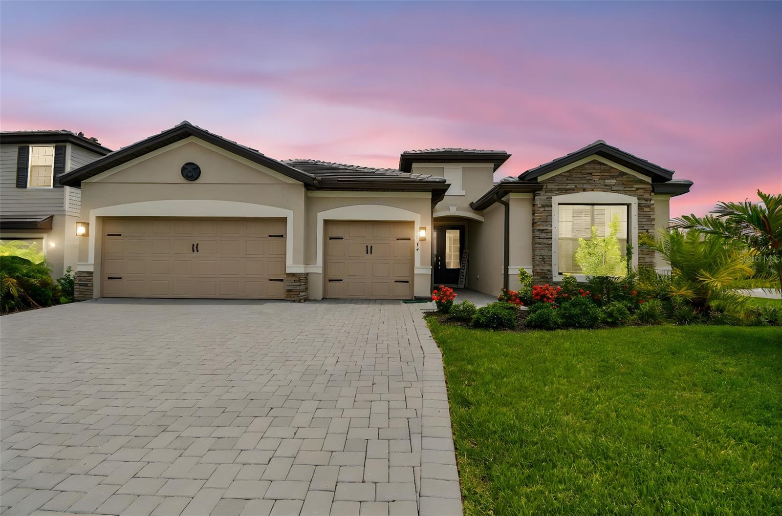 Stunning 2024 Summerville Model | 3 Bed + Den | 3 Bath | 3-Car Garage | Pool & Spa | Oversized Corner Lot...
Welcome to this beautifully upgraded, move-in-ready Summerville model located in the sought-after community of Lorraine Lakes at Lakewood Ranch. Built in 2024 and backed by a full builder warranty through August 2025, this exceptional home is perfectly positioned on an oversized, fenced corner lot at the end of a quiet cul-de-sac—offering both privacy and space.
This popular single-story layout boasts 3 spacious bedrooms, 3 full baths, a versatile den with custom barn doors, and a 3-car garage. The open-concept design seamlessly blends the great room, dining area, and chef’s kitchen—perfect for everyday living and entertaining. Designer upgrades include plank tile flooring throughout, custom wood ceiling beams, a stunning wood feature wall with a 100" electric fireplace, quartz countertops, a stylish tile backsplash, stainless steel appliances, a single-bowl sink, touchless faucet, and upgraded lighting and hardware.
The luxurious primary suite offers tranquil water views, two custom walk-in closets with built-ins, and a spa-inspired bathroom with dual vanities and a large walk-in shower.
Step outside to your own private resort-style retreat featuring a heated pool and spa, outdoor shower, covered lanai with dining and lounge areas, retractable awning, and an extended paver patio—all within a screened enclosure and surrounded by lush landscaping.
As part of Lorraine Lakes, residents enjoy gated entry and a full suite of resort-style amenities, including lawn care, high-speed internet and cable, a clubhouse with tiki bar and restaurant, fitness center, lap and resort pools, splash zone, indoor sports courts, arcade, tennis and pickleball courts, putting green, and more.
Located in Lakewood Ranch—the #1 multi-generational community in the U.S.—you’re just minutes from top-rated schools, golf, shopping, dining, parks, and community events. This home offers the perfect balance of luxury, comfort, and vibrant Florida living.