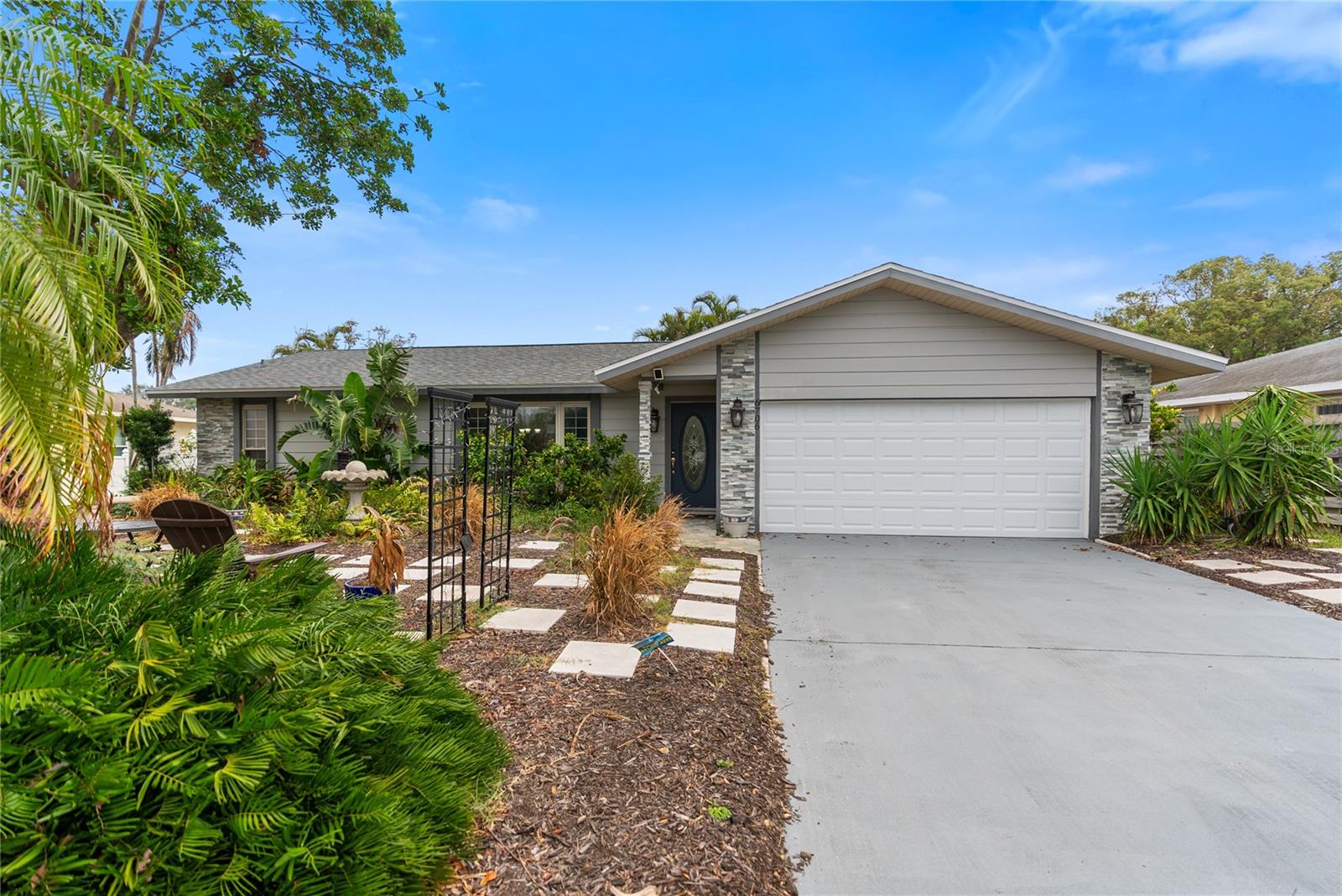 Welcome Home! close proximity to the highly desired Palma Sola Bay and Ana Maria Island, and low HOA Fees in a neighborhood that takes pride in being well kept; This home is really a deal of a lifetime. New roof and new AC so you have nothing to worry about. Nestled in the tranquil and spruced neighborhood of Pointe West, this charming, 3 bedroom 2 bathroom home on almost ¼ acre of land is ready for you to call your own. As you pull into the driveway, you’ll be impressed with the intricate stone detailing on the outside of the home, and the lush landscaping that greets you. Walking through the front door, this home instantly welcomes you with a warm and uplifting ambience enhanced by the abundance of sunlight flowing through. The formal living room offers a large beautiful bay window perfect for overlooking the varieties of plants and trees in the front yard, creating a lovely conversation starter for your guests. Granite countertops dressed with stainless steel appliances all complemented by a tasteful backsplash, this Kitchen is pristine and ideal to meet your culinary needs. The window above the sink allows you to overlook the backyard oasis. The kitchen also provides an entry way on each side, leading you to either the dining room or the living room, allowing for a seamless transition while entertaining guests. Whether enjoying a meal in the dining room or a game night in the living room, take full advantage of extending these activities to the back patio by opening the sliding doors located in each room. You can even take your meals outdoors for Al Fresco dining while enjoying Florida’s ideal weather on the patio in the backyard, which is brimming with personality. With a privacy fence and a multitude of fruit trees and palm trees along the perimeter, this backyard is the perfect place to escape from reality, feeling as if you’re in your own tropical oasis. While it may be difficult to leave this tranquil sanctuary, you absolutely have to slip into your flip flops, grab your beach chair, and leave all worries behind while you make your way to the gorgeous beaches of Anna Maria Island, only minutes away from this home. Imagine yourself sitting back listening to the rhythmic sounds of the waves gently crashing into the shore with your toes in the crystal sand, all while soaking up the sweet Florida sunshine. Come and see what this home has to offer and be prepared to leave in awe!