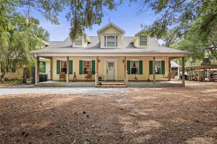 Gracefully set beneath a sweeping canopy of mature live oaks, this one-of-a-kind and charming 4-bedroom, 3-bath residence (with two additional half baths) rests on 4.25 acres of tranquil Flagler County landscape offering the rare feeling of seclusion along the scenic John Anderson Highway, yet just minutes to Flagler Beach, its iconic local restaurants, and the timeless beauty of low-lying, oak-lined roads.

Designed for simply majestic living, the home offers a warm, inviting layout with room to grow, including a bonus room that can easily serve as a fourth bedroom, home office, media room, gym, or flex space to fit your lifestyle. Step outside to relaxed Florida living at its best with a private gated entrance and a screened pool and lanai, perfect for quiet mornings under the oaks or effortless entertaining. And with 4.25 acres to enjoy, there’s still plenty of space for gardens, additional outdoor amenities, or future expansion.

For equestrian enthusiasts or anyone craving space to pursue outdoor passions...the property features a well-established horse setup including covered grooming stalls with wash area, fenced riding arena, pole barn, two run-in sheds, two tack rooms, and a feed room. Shaded oak groves and open pasture areas create a natural, calming flow for family, guests, and animals alike.

Whether you envision peaceful mornings beneath the trees, hosting friends and family, or embracing a low-stress lifestyle with room to roam, this estate offers a rare opportunity to create a private coastal retreat. With easy access to A1A, I-95, and all that Flagler Beach has to offer, this property truly delivers the best of space, privacy, and location. NO HOA! Schedule your private tour to experience the serenity for yourself.