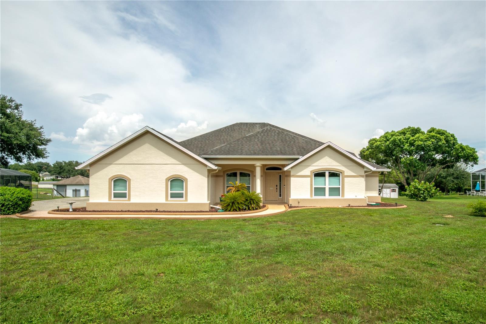 Custom-Built Home on 1.15 Acres in the Hills of Mount Dora! Discover the perfect blend of rural charm and modern convenience in this beautifully designed 4-bedroom, 3-bathroom home, complete with a 14x13 bonus room and situated on a spacious 1.15-acre lot with no rear neighbors. Located in the sought-after Hills of Mount Dora, this home offers privacy, flexibility, and thoughtful upgrades throughout. Step inside to find a well-designed split bedroom floor plan that includes a large front office or optional 5th bedroom—ideal for guests, working from home, or multigenerational living. The open kitchen features a center island, 42” solid wood cabinetry, and a built-in desk area, creating a functional and inviting space for everyday living and entertaining. Enjoy the outdoors from your oversized covered lanai, accessed through elegant French doors, or relax on the tongue-and-groove wood-accented front porch and back patio, all while taking in the peaceful natural surroundings. Recent upgrades include all-new energy-efficient windows and doors and a 24kW whole-house generator for peace of mind and energy savings. Whether you're enjoying quiet evenings at home or hosting family and friends, this property is designed for both comfort and style. Conveniently located just minutes from downtown Mount Dora and with easy access to the 429 toll road, you’ll enjoy quick connections to Orlando while coming home to the tranquil beauty of Central Florida. Don’t miss this rare opportunity to own a custom home in one of Mount Dora’s most desirable neighborhoods.