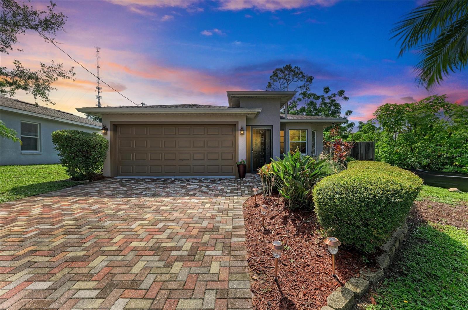 Discover an elegantly updated 3-bedroom, 2-bath single-family home with 1,524 square feet of beautifully finished living space on a generous 5,662 square feet lot at the end of a cul-de-sac in Central Sarasota. Built in 2012, this residence seamlessly blends custom design touches with every day functionality. Arriving you will find a pristine curb appeal of a paver driveway, landscape curbing, fresh mulch, low maintenance landscape, fenced yard, and storm friendly exterior features of the home hurricane rated garage door, hurricane shutters and 'X' flood zone. Walking in you will be greeted with an open floor plan with a new custom chef’s kitchen with soft close designer cabinets, quartz counter tops, Cafe Series appliances, farm sink, tiled backsplash, under cabinet lighting, and eat in island. 24" tiles continue throughout the home creating open flow to the home. The plantation shutters throughout give an elevated design to the space for allowing natural light and privacy. The split floor plan provides sizable guest rooms with closets and a guest bath. The owner's suite has privacy in the back of the home with its own lanai access, walk-in closet with custom wood shelving, dual-sink vanity, and spacious walk-in Roman-style shower in master bath . The sliding glass doors are ideal for indoor-outdoor living and access to the fenced yard feeling like your own Florida Oasis.
Nestled in the heart of Sarasota’s Fruitville neighborhood, enjoy effortless access to:
Downtown Sarasota’s charm and cultural amenities, Siesta Key beaches, a wealth of dining, shopping, entertainment, and recreation options
Highly rated schools (Fruitville Elementary, McIntosh Middle, Sarasota High), and much more!