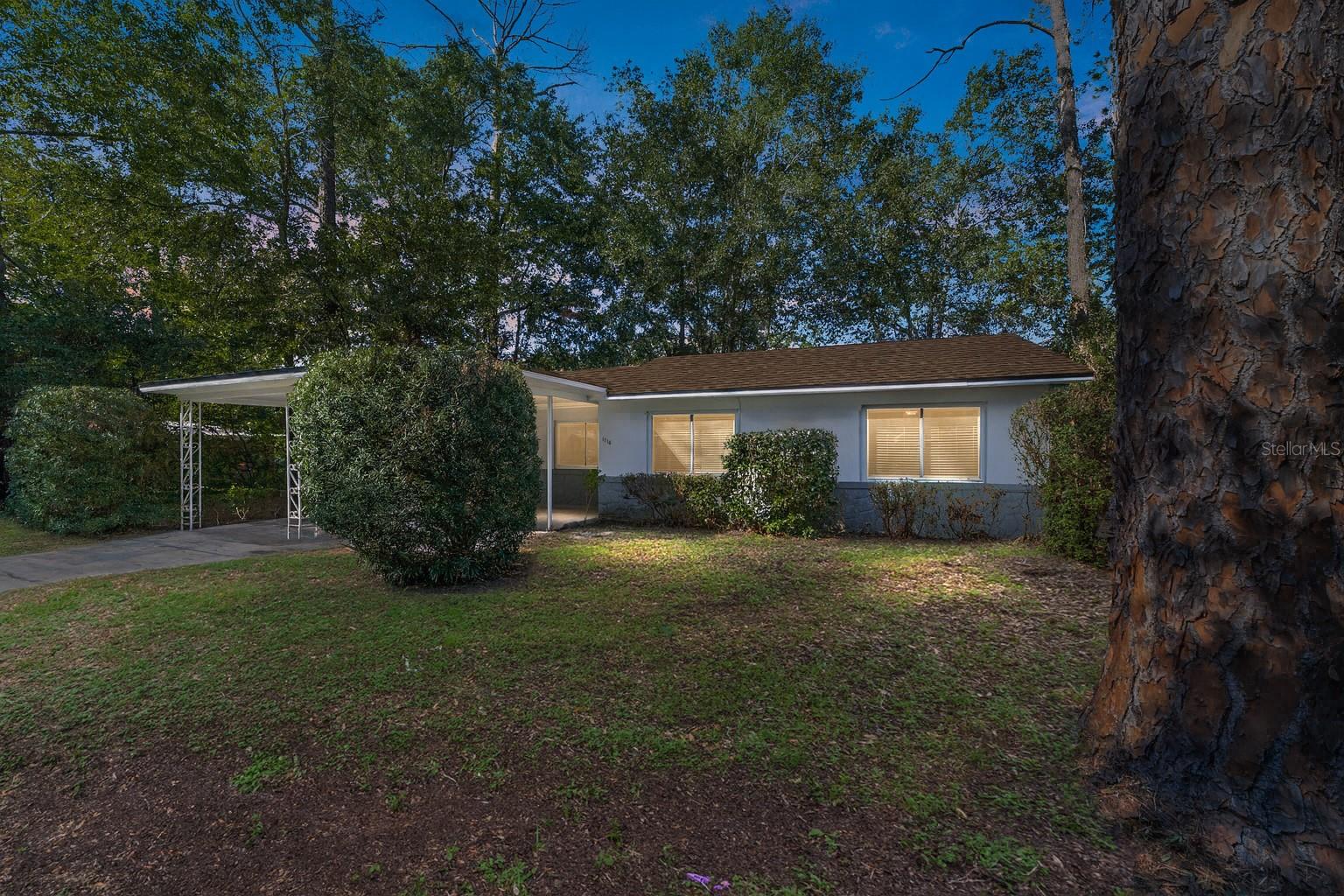 One or more photo(s) has been virtually staged. Charming Northeast Gainesville Home.
This, move-in-ready 3-bedroom, 1-bath home blends classic character with key updates: original hardwood floors, stone countertops, and newer kitchen appliances (gas range), plus a brand-new roof (2025), newer HVAC (2023) & water heater (2022), and updated electric, plumbing, and double-pane windows.
The spacious carport and permanent shed add convenience and storage.
Set among mature trees just .2 miles from Tom Petty Park and St. Pat’s School, this home offers both comfort and location—with Gainesville-famous Satchel’s Pizza just a mile away.
A perfect balance of style, function, and neighborhood charm in the heart of Gainesville.