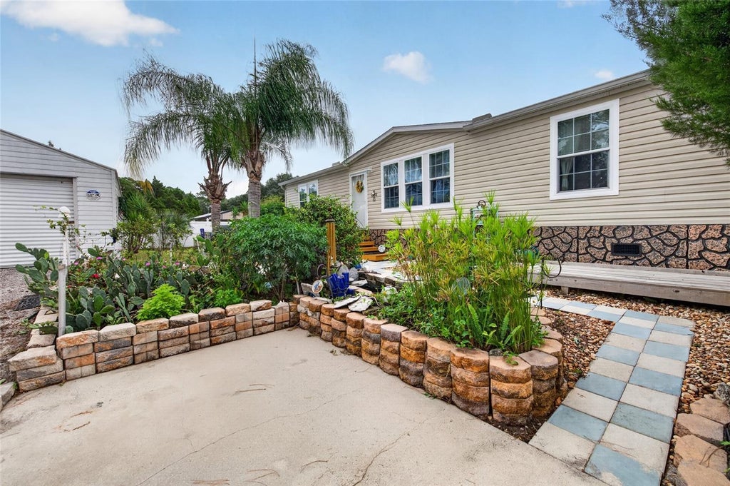 Photo of 375 Beehive Drive, Oak Hill, FL 32759 (MLS # NS1089366)