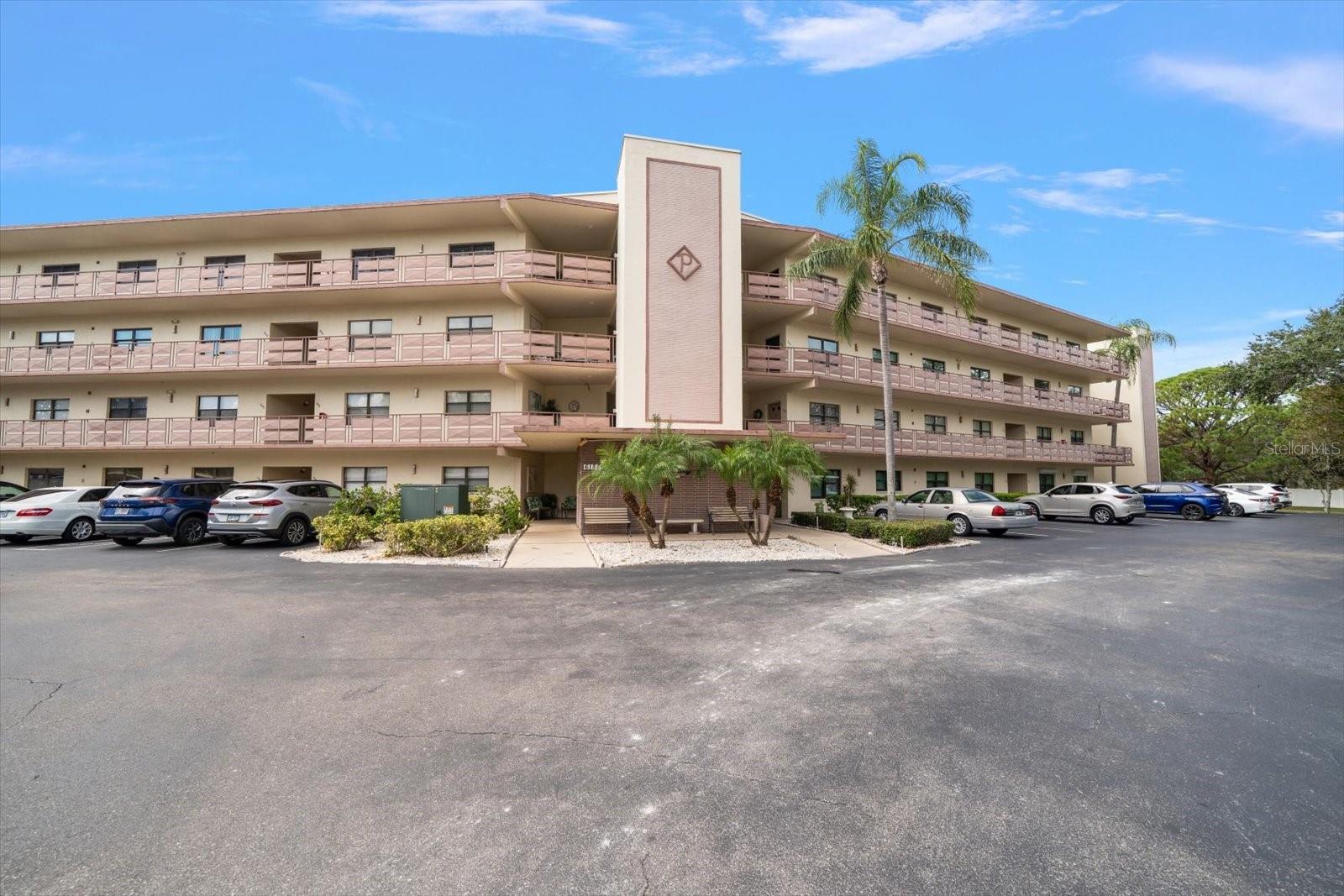 Beautifully Remodeled Corner Condo in Active 55+ Community in St. Petersburg! Step into modern comfort and style in this completely remodeled corner unit located in one of St. Petersburg’s most desirable 55+ communities! This attractive condo offers an open floor plan filled with natural light and peaceful views of the pond from your private balcony. The brand-new kitchen features granite countertops, a new island, custom cabinets, and all new appliances—including a gas range and dishwasher—perfect for cooking and entertaining. Both bathrooms have been remodeled with tasteful finishes with a walk-in shower in the primary bedroom's en-suite bath. The new flooring throughout adds a fresh look. Enjoy the convenience of your own in-unit washer and dryer and a dedicated carport parking space. This popular and beautifully landscaped community is a nature lover’s paradise, complete with serene ponds, mature shade trees, and expansive lawns. Residents enjoy an active, social lifestyle with access to two clubhouses, six pools (two of which are heated), a hot tub, two tennis courts, pickleball courts, two fitness centers, shuffleboard courts and theater group entertainment. Join in on clubs, card games, tournaments, and fitness classes—there’s always something happening!  RV Storage is available and there is also a car washing area. Located just minutes from shopping, dining, bus routes, and the beach, this condo offers the perfect blend of relaxation, convenience, and community. Don’t miss your chance to live in this beautifully updated unit in one of St. Petersburg’s most vibrant 55+ communities!