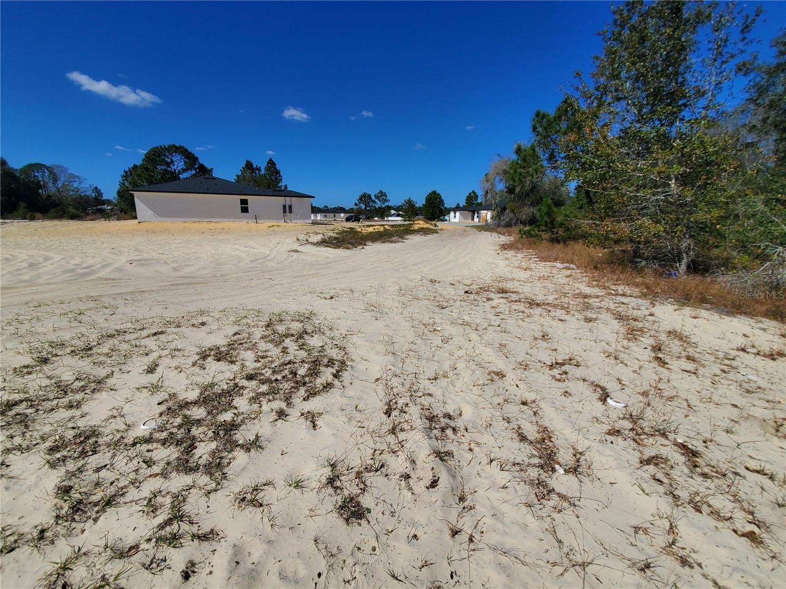 UNBELIEVABLE OPPORTUNITY! Own a piece of paradise in Poinciana! Construction has just begun next to this clear vacant lot; water and sewer lines have entered the final stage of approval. Perfectly located in a growing residential area. Enjoy a paved street and cul-de-sac location. Build your dream home near: Poinciana Lakes Plaza, New Hospital Major Parks (25 minutes), SunRail Poinciana Station (30 minutes), Walmart, Publix, and restaurants. Surrounded by growing developments, this lot offers a chance to be part of Florida's dynamic market. Don't miss out – make it yours today!