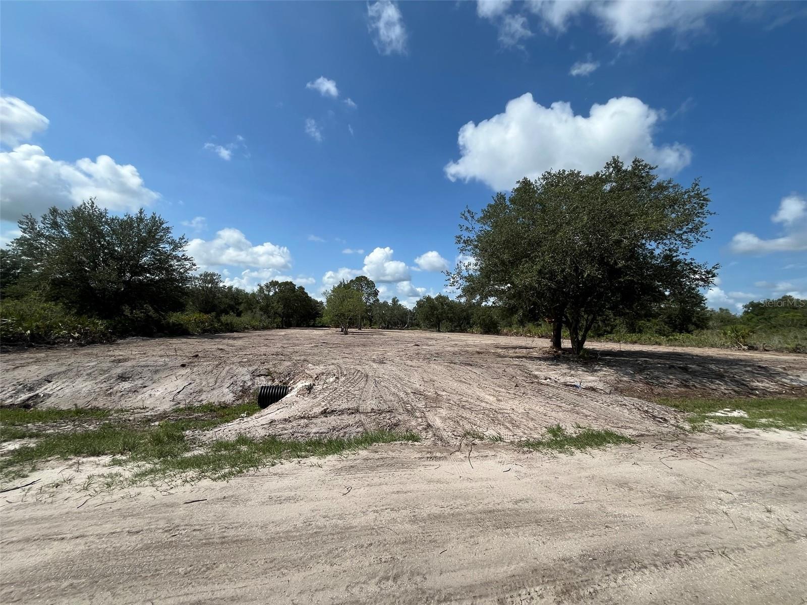 Build or bring your dream home on this spacious 1.25-acre cleared lot. Cleared with culvert in place. Not far off the paved road. Residents can enjoy the privacy of a rural setting while still being close to essential amenities. The area is a haven for outdoor enthusiasts, boasting attractions like the Kissimmee River Preserve State Park and the expansive Lake Okeechobee, famous for its excellent fishing opportunities. Whether it's fishing, hunting, agriculture, or simply a desire for privacy, Okeechobee County provides an idyllic backdrop to create a personalized retreat.