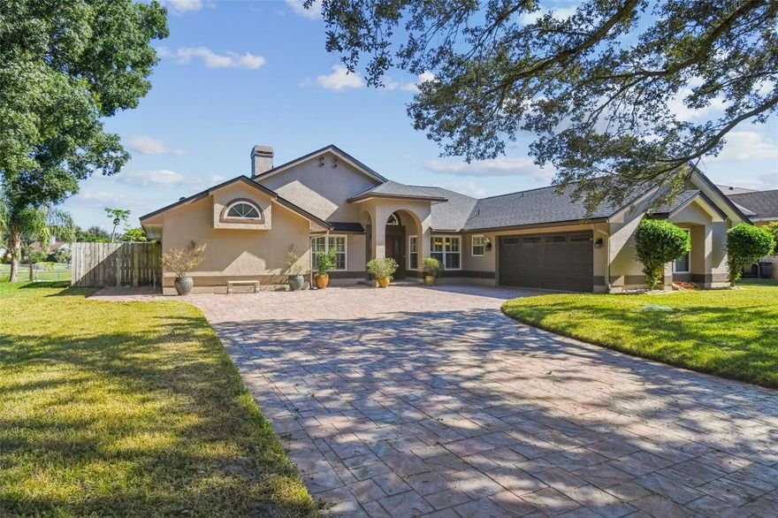 Welcome to the desirable Sand Lake Point community in Dr. Phillips! This stunning 3-bedroom, 2-bathroom pool home sits on a quarter-acre lot overlooking a serene pond, offering the perfect blend of indoor comfort and classic Florida outdoor living. The remodeled kitchen features 42-inch cabinets with crown molding, two lazy Susans, granite countertops, backsplash, and stove exhaust vented outside. The breakfast nook includes built-in storage and a matching granite tabletop, making it an ideal space for casual meals or morning coffee. The family room offers built-ins and a wood-burning fireplace (inspected and cleaned in 2023), plus a versatile flex space perfect for a reading nook or home office. Luxury vinyl plank flooring, plantation shutters, and new sliding glass doors with a transferable lifetime warranty complete this inviting living area. The primary suite boasts luxury vinyl flooring, a private ensuite with dual vanities, walk-in shower, private toilet closet, and a large custom closet system conveniently located in the bathroom. Two additional spacious bedrooms share a full bathroom with a shower/tub combination and direct access to the pool lanai via a private hallway. Step outside to your private Florida oasis, featuring a screened pool, surrounding pavers, pizza oven, and a 52x13 covered lanai with tranquil pond views—perfect for entertaining or relaxing. The home also features beautiful curb appeal with an extended paver driveway. Recent updates include a home replumb, new roof and flashings (2024), new septic system, tank cover, and filter (2024), new septic drain field (2021), all-new windows with transferable lifetime warranty, new AC ducts (2025), GE refrigerator and dishwasher with 5-year warranty (2024), and a new AC & handler (2016). Sand Lake Point offers exceptional amenities including a clubhouse, lighted tennis and pickleball courts, a playground, and private boat ramp and dock on Big Sand Lake—a 1,200-acre lake ideal for skiing and fishing. Just outside the community, a path leads to Sand Lake Elementary, Dr. P. Phillips Community Park, Little League baseball fields, hiking trails, sports courts, picnic areas, pavilions, and a dog park. This prime location is minutes from upscale shopping, Restaurant Row, theme parks, O-Town West, major roads, airports, and downtown Orlando. Don’t miss this beautifully updated home in a sought-after neighborhood with top-rated schools!