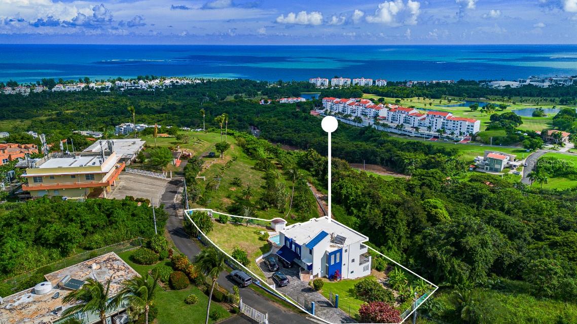 Privately tucked in the mountain side of Rio Grande. Just 2 minutes away from Las Picuas and Grand Rio Mar Resort. Live the dream of a Caribbean paradise with 180 degrees of ocean view overlooking the resort's golf course. No expenses were spared in this exquisitely fully remodeled home. All with imported materials from Europe and come fully furnished with the most impeccable taste. The open layout main living room opens up completely to a stunning view of the Atlantic Ocean. There truly is no other house in the area like this. Perfect for hosting lavish parties or just relaxing in your own private retreat. The home consists of 3 BR and 4.5 bathrooms. Master bedroom has two fully remodeled bathrooms and also has direct ocean view. Kitchen and bathroom were all equipped with top of the line appliances sure to amaze the most demanding Chefs.
Just 40 minutes from Luis Muñoz MarÃn Airport, you're ideally situated to explore El Yunque, the largest rainforest in the Caribbean, while enjoying all the luxurious amenities Grand Rio Mar Resort and golf course (with paid membership). Live the dream, at the place where your acquaintances come to vacation.