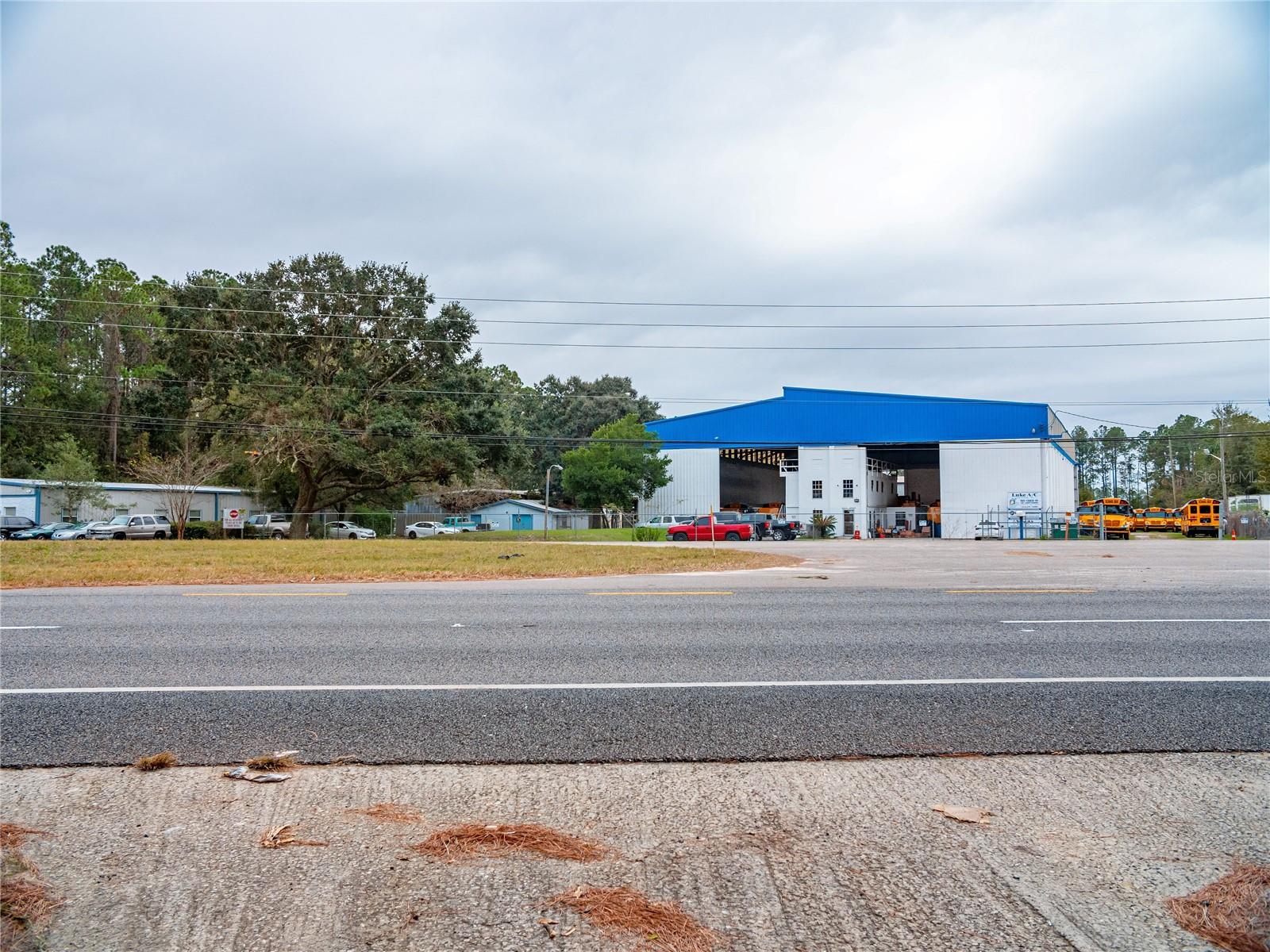 HIGH VISIBILITY in growth area! Don't miss out! Commercial (CCG1) with grandfathered Residential homestead. Strategically positioned with direct access to the First Coast Expressway and I-10, this 1.07-acre commercial parcel (CCG-1 zoning) offers outstanding visibility along the high-traffic corridor of Normandy Blvd. The mostly cleared lot presents flexible development options, including potential for retail, office space, self-storage, daycare, mobile home lots, and more. 3-bedroom, 2-bath manufactured home equipped with well water, septic, and electricity—ideal for use as an on-site office or transitional housing during development. Located just five minutes from major distribution hubs—including Amazon, Wayfair, and Chewy fulfillment centers—as well as Cecil Commerce Center, Herlong Recreational Airport, and a new Publix-anchored shopping center has been built on the corner..
With its high visibility, versatile zoning, and proximity to the Toll Road and I-10 and sought after growth in a rapidly expanding corridor. Sold AS-IS. Schedule your showing today and explore the potential of this rare find. A credit up to $4,000 toward buyer closing costs and prepaids when loan is secured through Moises Hall Rate Mortgage, NMLS2299273.