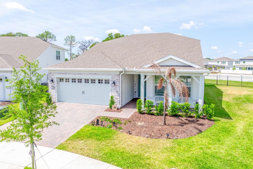 Welcome to this elegant and NEARLY NEW 4-bedroom, 3-bath home in the highly sought-after Del Webb Oasis of Winter Garden, a GUARD-GATED 55+ community where luxury, comfort, and lifestyle come together beautifully. Built in 2025 and offering over 2,800 SQUARE FEET, this residence features the LARGEST FLOOR PLAN in the community and is perfectly situated on one of the MOST EXPANSIVE LOTS providing both space and privacy. From the moment you arrive, the home impresses with its REFINED CURB APPEAL and spacious 2-car garage with an additional TANDEM BAY—ideal for a golf cart or extra storage. Inside, you’ll find a bright, open-concept design enhanced by LUXURY VINYL PLANK FLOORING that flows seamlessly through the Living Room, Dining area, and Kitchen. NATURAL LIGHT pours into the main living spaces through large windows with ELECTRIC BLINDS and dramatic corner sliding glass doors, creating a seamless transition to the outdoor living area. The Kitchen is a TRUE SHOWPIECE, thoughtfully designed with white cabinetry, stone countertops, a stylish tile backsplash, stainless steel appliances, BUILT-IN OVENS, a gas cooktop, a closet pantry, and an oversized breakfast bar that anchors the space beautifully. The Primary Suite, located on the main floor, offers a private retreat with ABUNDANT NATURAL LIGHT and serene backyard views. It features a CUSTOM-DESIGNED WALK-IN CLOSET (2026) and a SPA-INSPIRED EN SUITE BATH with dual sinks, a dedicated makeup area, a walk-in shower with built-in seating, and a private water closet. Also on the main level, you’ll find a secondary bedroom and full bath, along with a FLEXIBLE OFFICE SPACE behind glass French doors that can easily serve as a fourth bedroom. A Mudroom and well-appointed Laundry Room—complete with washer, dryer, cabinetry, and COUNTER SPACE—add everyday convenience. Upstairs, a GENEROUS LOFT AREA offers incredible versatility, currently enhanced with a CUSTOM COFFEE BAR (2025) and large enough to accommodate additional living, entertaining, or even a future bedroom while still maintaining open loft space. An ADDITIONAL BEDROOM AND FULL BATH upstairs provide the perfect setup for guests. Step outside to your EXTENDED COVERED PAVER PATIO, complete with a SUMMER KITCHEN (2025) and set beneath an oversized screened lanai, all enhanced by CUSTOM OUTDOOR LIGHTING (2025). This home has been further enhanced with thoughtful upgrades, including a WATER FILTRATION AND SOFTENER SYSTEM (2026), FENCED BACKYARD (2025), and expanded outdoor living features that elevate both comfort and functionality. Residents of Del Webb Oasis enjoy RESORT-STYLE AMENITIES, including a clubhouse, sparkling pool, fitness center, tennis courts, and social activities, along with included cable and internet, fostering an active and connected lifestyle. IDEALLY LOCATED in Winter Garden, you’re just minutes from the charm of HISTORIC DOWNTOWN WINTER GARDEN, known for its boutique shopping, dining, and weekly farmers market. Enjoy OUTDOOR RECREATION along the West Orange Trail, or take a short drive to WORLD-CLASS ATTRACTIONS like Walt Disney World Resort. Convenient access to major roadways makes exploring all that Central Florida has to offer effortless. This exceptional home offers a RARE OPPORTUNITY to enjoy elevated, low-maintenance living in one of Winter Garden’s premier active adult communities—where every detail has been THOUGHTFULLY DESIGNED for both luxury and ease. Now is the time—don't miss your chance to call this home!