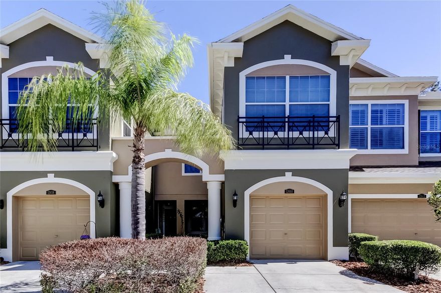 Beautiful maintenance-free gated community offering a 3 bedroom, 2.5 bath townhome on a private conservation lot in the highly desirable Westchase area — and located in a NO FLOOD ZONE for added peace of mind. As you enter, you’ll appreciate the large open modern layout filled with natural light. The spacious kitchen features 42" hardwood cabinets, Corian countertops, pantry storage, and large windows and sliders overlooking the conservation. A downstairs flex space makes the perfect office, playroom, or additional sitting area, and ceramic tile throughout the first floor provides easy maintenance along with a convenient half bath for guests. Upstairs, retreat to your oversized primary suite complete with a huge walk-in closet and private screened-in balcony overlooking peaceful conservation. The en-suite bath offers double vanities, hardwood cabinetry, a walk-in shower, and soaking tub. Two additional generously sized bedrooms and a full guest bath complete the second floor. Step outside to your extended patio and enjoy true Florida outdoor living with no rear neighbors. Thoughtful updates include interior paint, upstairs flooring, staircase, carpet, light fixtures, fans, blinds, downstairs vanity and bathroom counters completed in 2019, plus a water softener (2022), microwave (2022), dryer (2024), and a brand new roof installed in 2025. The living room is wired for surround sound, and water and sewer are included in the HOA. Community amenities include a large pool and two playgrounds. Zoned for some of the best schools in the county and conveniently located near major shopping, just 20 minutes to Tampa International Airport and 20 minutes to area beaches — an unbeatable Westchase location.