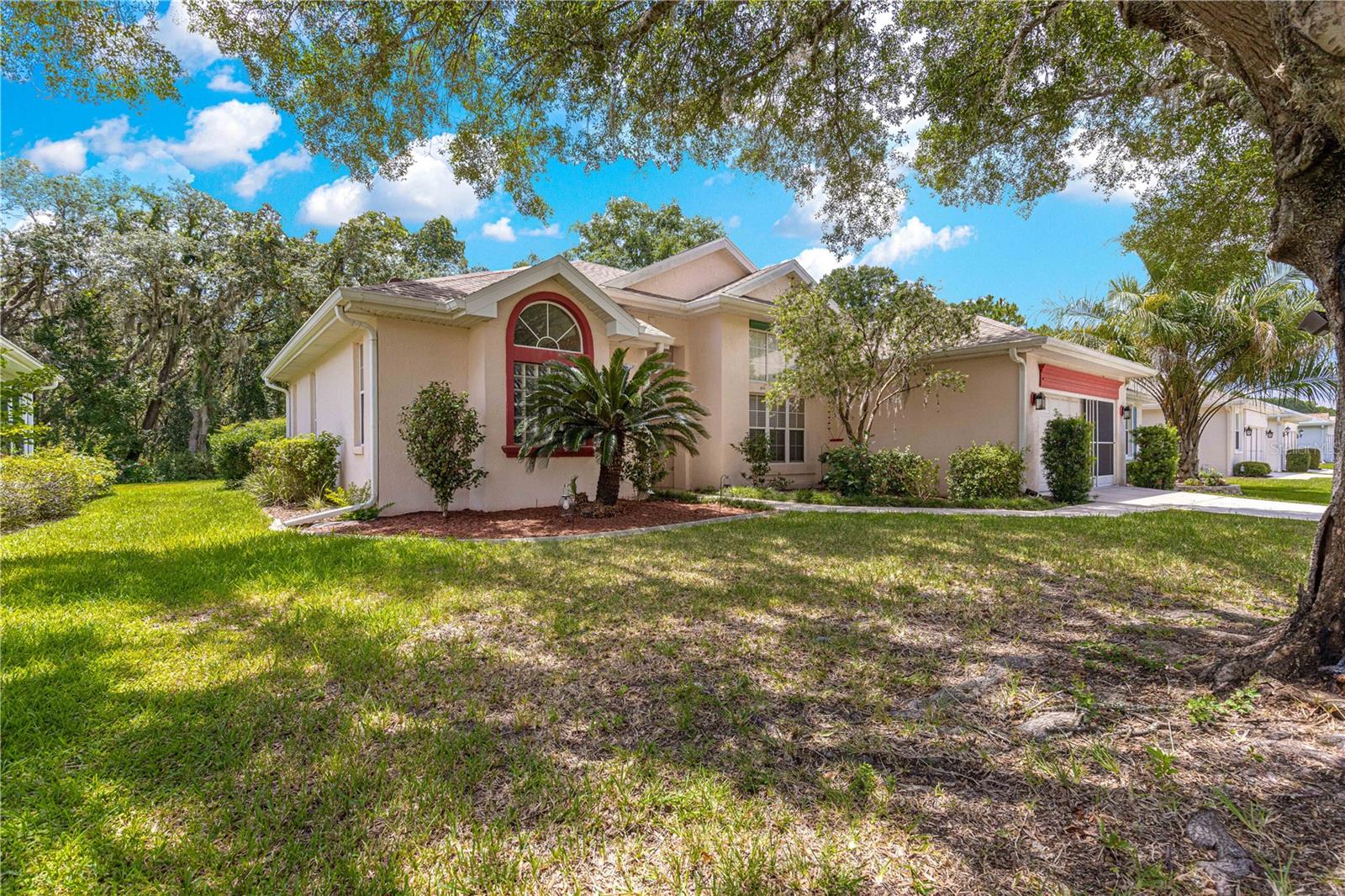 What an awesome location! The Preserve is in the rear of the for a quite and peaceful view. The front of the home faces an green space with no home. Quite street with only people that live on the street using it. This home has been lovingly cared for. When you enter the foyer you are welcomed by the tall widows in the family room. This home boast a living room, breakfast nook which could be used as an office. The master has it own private wing that has sliders to the lanai.
The master bath has 2 vanities and separate tub and shower. There is also his and hers closets. The lanai is 22 X 14 and is currently it is being used for crafts. Beyond the Lanai is a birdcage with a hot tub(it does have a leak and seller is not prepared to repair). Then there is an open patio as well to enjoy nature and the trees. The kitchen has granite counters and a breakfast bar. The laundry room has a stackable washer and dryer, and laundry sink. The garage has a great space for a workshop tucked in the back of garage. All of this and you are minutes from the golf course, pool and fitness center. ROOF IS 2022, WASHER AND DRYER 2024 MICROWAVE, DISHWASHER AND RANGE ARE BETWEEN 5-8 YEARS REFRIGERATOR 2023,