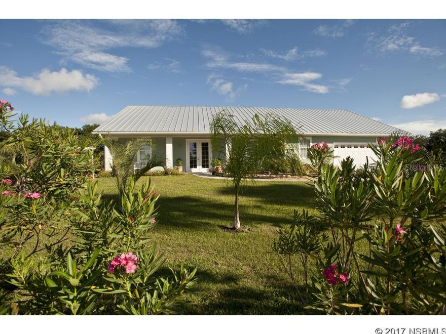 2014 Custom Built Waterfront Home on a Quiet Flower Filled Acre, and just 15 minutes from the Beach. This Wonderful home is Open and Spacious, with  a Picturesque Setting that provides the Ultimate in Peaceful Settings. 280 Feet of Water Frontage. Incredibly well Constructed with Hardy Board over Concrete Block Exterior, Impact Glass, Foam Insulation. An 8 x 16 Floating Dock is Perfect For a Small Boat. Live Your Life among the Oleanders !!!!! ;Water: City