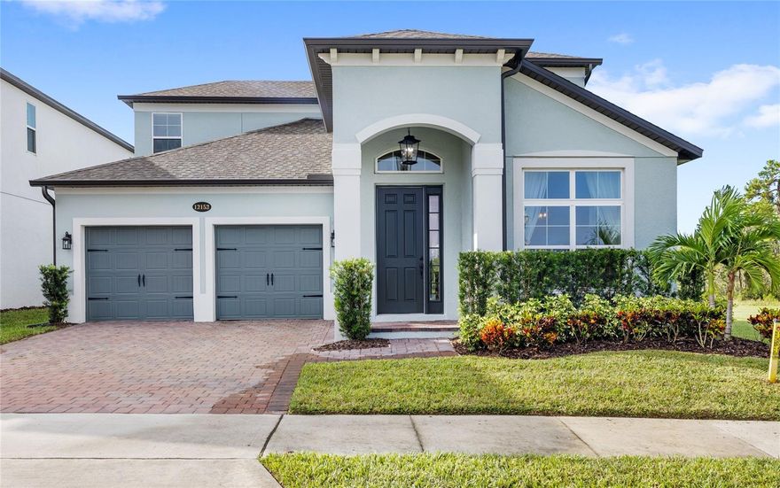 One or more photo(s) has been virtually staged. This stunning 4-bedroom, 3.5-bath home in the sought-after Encore at Ovation community offers 3,224 square feet of beautifully designed living space on a premium corner lot backing to a serene pond, Lake Mack, and conservation views. Enjoy incredible privacy and breathtaking sunrise and sunset views from your fenced backyard or second-floor balcony.

The gourmet kitchen features stacked cabinets, GE Profile stainless steel appliances, upgraded lighting and plumbing fixtures, and designer tile flooring. The open floor plan flows effortlessly into spacious living and dining areas—perfect for entertaining or relaxing with family. An upstairs loft also adds to the home's versatility. 

The first floor primary suite is a private retreat with two walk-in closets and a luxurious en suite bath. All bathrooms throughout the home feature upgraded tile, fixtures, and hardware, adding to the home’s modern elegance.

A covered and sealed corner patio provides an inviting outdoor retreat, ideal for year-round Florida living.

Encore at Ovation offers resort-style amenities including a community pool, clubhouse, fitness center, dog park, playgrounds, walking paths, and outdoor fitness stations. Landscaping is included, and the HOA regularly hosts neighborhood events.

Located just 5 minutes from Disney property and within a top-rated school district, this home combines luxury, convenience, and an unbeatable setting.  This home is built to save you by being built to Energy Star 3.1 standards and is third-party rated for energy efficiency and is backed by M/I Homes 7 Year Construction Defect Warranty and 10-Year Transferrable Structural Warranty.