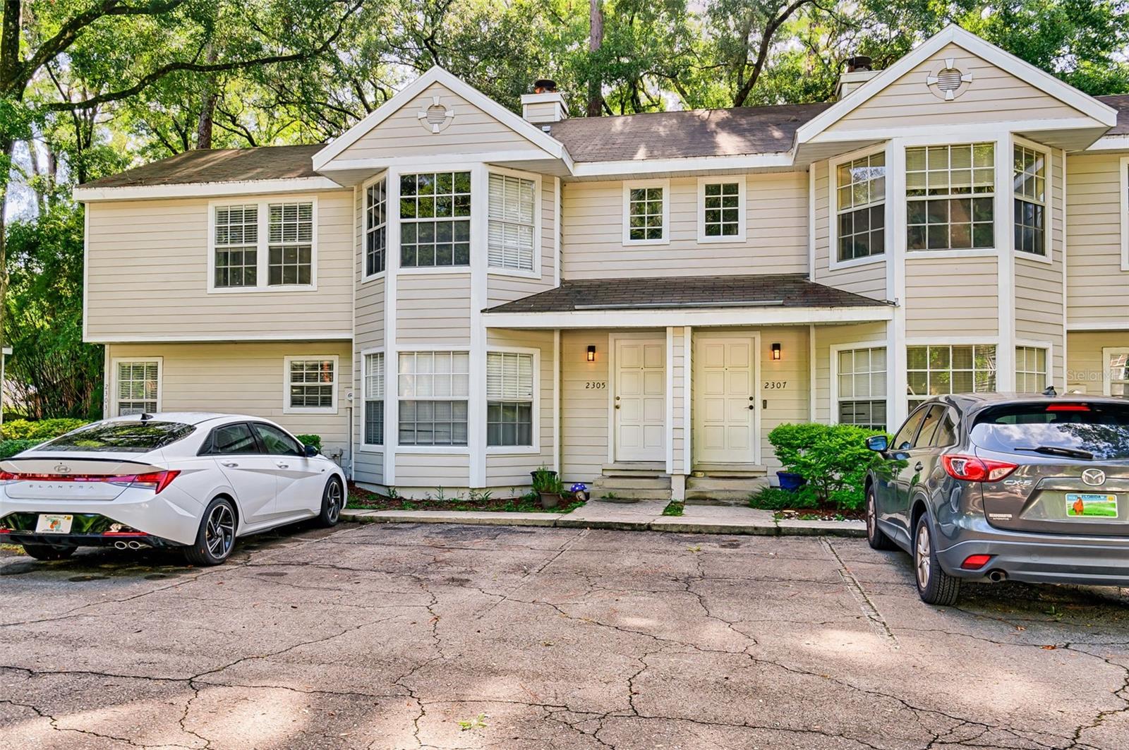 Welcome to this well-maintained and thoughtfully updated 2-bedroom, 1.5-bathroom townhome offering 1,148 sq. ft. of comfortable living space in the desirable Carriage House Lane community!
Step inside to a cozy living room featuring a wood-burning fireplace, perfect for relaxing evenings. The kitchen and dining area flow nicely to the back patio, now enhanced by a new French door and surrounded by a privacy fence—ideal for outdoor gatherings or peaceful mornings with coffee.
Enjoy modern upgrades throughout, including a new A/C unit (1.5 years old) and a recently renovated shower (2 years ago). A convenient half bath downstairs is perfect for guests, while upstairs you’ll find the primary suite, a second bedroom with a gorgeous bay window, and a shared full bath that brings in tons of natural light.
The fully fenced yard adds privacy and security, making this home move-in ready with all the charm and comfort you’ve been looking for.
Don’t miss your chance to own this gem in a great location—schedule your showing today!