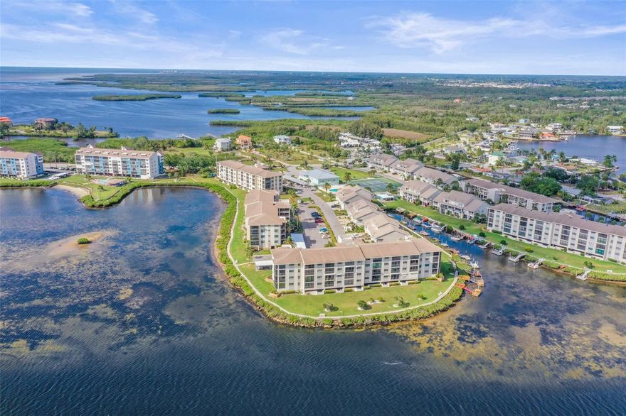 Wake up to waterfront views, step onto your boat, and embrace the ease of maintenance-free coastal living in the gated Gulf-front boating community of Sand Pebble Pointe. This beautifully maintained 2-bedroom, 2.5-bath townhome with a den/office offers all main living spaces on the second floor, creating elevated privacy, vaulted ceilings, and peaceful balcony views overlooking the water. The ground level entry is a beautiful outdoor garden, setting the tone for your coastal retreat. There are two balconies on the living level, the rear balcony overlooking the Cotee River and the front balcony providing seasonal sunset viewing over the Gulf. On the ground level there is additional outdoor living space, with a large, screened lanai running the full width of the townhome. The kitchen and baths were renovated just 2 years ago, including new appliances. This end unit features many additional windows to fill the interior of the home with natural light.
Designed for effortless everyday living, the residence features a private elevator, spacious screened patio, and an oversized garage with room for up to 3 vehicles or additional storage for your golf cart, kayaks, fishing gear, and more. The updated kitchen showcases granite countertops, stainless steel appliances, and generous cabinetry, while both bedrooms offer comfortable retreats for owners and guests alike. A deeded boat dock provides direct access to the Gulf, making sunset cruises and boating adventures part of daily life. This home is outfitted with smart home features to make daily life extra convenient. Sand Pebble Pointe offers an exceptional amenity package including a resort-style waterfront pools, tennis courts, putting green, fitness center, clubhouse with banquet and game rooms, library, gated entry, and beautifully maintained grounds, boardwalk, community boat ramp and RV park. Whether you’re searching for a full-time waterfront residence or a lock-and-leave Florida retreat, this home delivers the perfect balance of comfort, boating lifestyle, and community living.