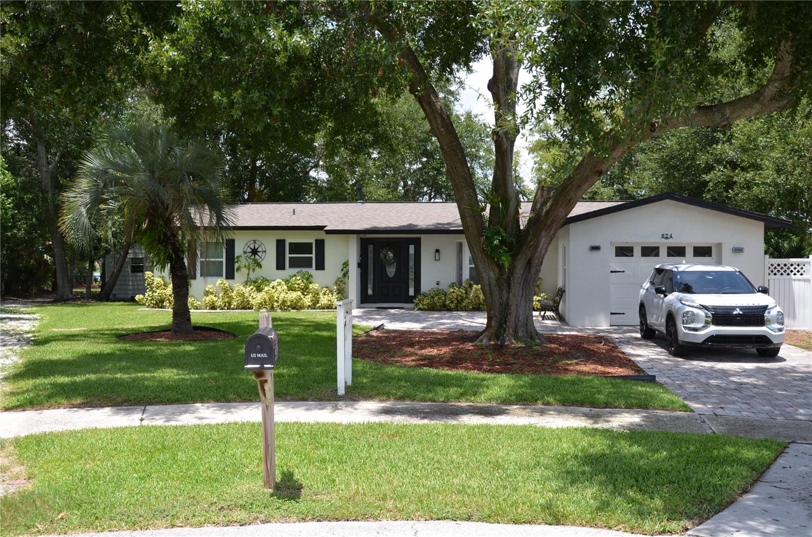 LAKE FRONT OASIS, Come and Experience the lakefront living at its best in this stunning 4-bedroom, 2 baths home sitting on a peninsula just under 1 acre land overlooking Lake Gleason. *** FULLY FURNISHED*** THIS IS A VERY RARE OPPORTUNITY. UPDATED ROOF, UPDATED FLOORING, UPDATED PLUMBING, UPDATED ELECTRICAL, UPGRADED APPLIANCES, UPDATED WATER HEATER & UPDATED KITCHEN APPLIANCES. COMPLETELY REMODELED IN 2021, OVERSIZED LOT WITH 2 PRIVATE ENTRANCES, MULTIPLE FIRE PLACES, with a Florida room over looking the lake to catch the beautiful sunsets. This home seats on a cul de sac with no traffic. If you've been dreaming of a life by the water, this is your chance to make it a reality. As you step inside, you'll be welcomed by the beauty of this home. Owner used the property as an airbnb. This opportunity is for either investors, retired or anyone looking for almost an acre on the water. The Master bedroom has views of the lake, spectacular standup double showers. The Kitchen quartz countertops, double oven for entertaining with a gas range, subway tiles with a farmhouse sink. The backyard is a breath taking, also includes a 12' X 18' storage/shed, oak trees, lake views, complete tranquility. All of this only within minutes of 2 Publix stores in either direction, easy access to I-4, I-95, minutes to the beaches, 30 mins to downtown Orlando and 45 to Disney World.