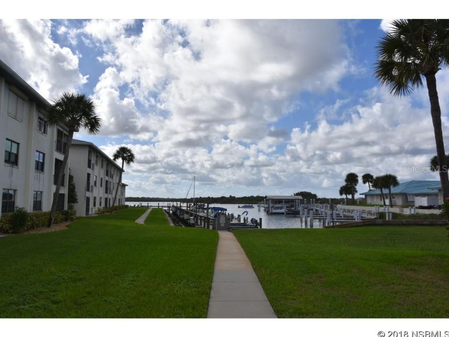 Awesome north beach riverfront community, only 40 units in the community.  Renovated over the past several years and well cared for unit with 2 bedrooms, 2 baths, spacious living/dining area, large open kitchen plenty of cabinet and countertop space.  Two spacious bedrooms with good sized closets, inside laundry, year around glassed Florida room and more.  HVAC replaced in 2013.   Assigned parking, assigned outside storage, plenty of guest parking.   The community features a large pool and spa currently being retiled, large renovated club house with full kitchen and restrooms.  Fishing pier, kayak storage and boat slips which occasionally become available to either rent or purchase. HOA fees include cable tv, internet, pest service, exterior maintenance, pool, clubhouse, etc.  Enjoy watching the manatees and dolphin from your unit, along with the beautiful sunsets on the river.   Call today to view this well priced unit and start living the NSB Island Dream! ;LocationDescription: Condo ;Water: City