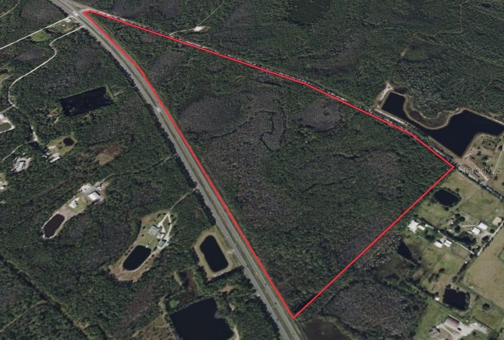 Photo of 4430 Pioneer Trail, New Smyrna Beach, FL 32168 (MLS # O6453538)