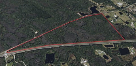 Photo of 4430 Pioneer Trail, New Smyrna Beach, FL 32168 (MLS # O6453538)