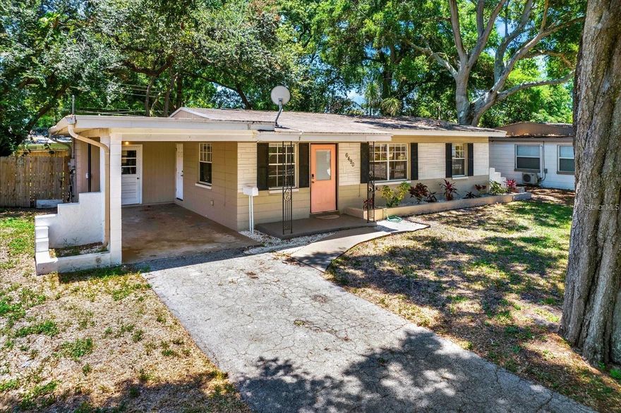 Welcome to your Mid Century Modern retreat in the heart of St.Petersburg!
Perfectly positioned less than 15 minutes from both Downtown St. Pete and the beaches, this inviting home blends style, comfort, and convenience. Located in a non-flood zone, you’ll enjoy peace of mind and a true sense of community in one of St. Pete’s most sought-after neighborhoods.

Step inside to a bright, open-concept living space filled with natural light. The living room flows effortlessly into a spacious dining area and a tastefully updated kitchen with new quartz countertops (2022) and luxury vinyl plank flooring (2022) throughout. The layout offers the perfect balance between open flow and privacy, with the kitchen thoughtfully tucked away yet easily accessible for entertaining.

Each of the three bedrooms features relaxing coastal-inspired tones that bring the nearby shoreline to mind. The updated bathroom includes both a tub and shower for everyday comfort.

Outside, your spacious and shaded backyard is ready for your imagination-add a pool, create an entertainer’s deck, set up a play area or dog run, or design your own private oasis under the mature trees.

Additional highlights include a dedicated laundry room, private driveway with carport, and a quiet residential street with speed bumps for safety.

If you’ve been searching for a well-maintained home in a prime St. Pete location-with room to grow, relax, and make your own-this is it. Schedule your private tour today and experience the charm of St.Pete living for yourself!