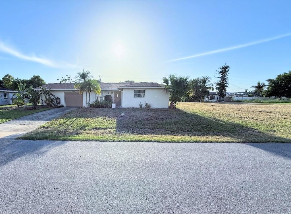 Photo of 156 Francis Drive NE, Port Charlotte, FL 33952 (MLS # O6367426)