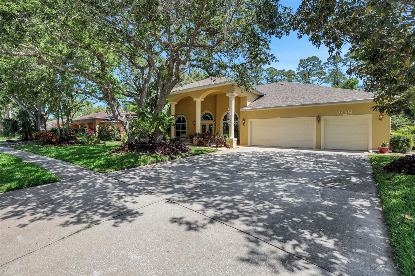 LARGEST AVAILABLE FLOORPLAN IN GATED SABAL CREEK - Experience refined living in this meticulously maintained 3,190 sq ft open floorplan residence with 12' ceilings and PACKED with superior upgrades. Located in a highly sought-after gated community, and a top-rated school zone in Port Orange. This thoughtfully designed home offers 4 spacious bedrooms, including an oversized primary suite and a second private en-suite, plus a versatile flex room perfect for a home office, playroom, or guest space. With 3 full bathrooms, a formal dining room, and an open-concept layout, the home is ideal for both everyday living and entertaining. The kitchen features a gas range and flows seamlessly into a large great room with a cozy gas fireplace, creating a welcoming space full of natural light and warmth. Recent upgrades offer both peace of mind and long-term value, including a 2.5-year-old roof, and a 4-year-old A/C system, pool heater, and dishwasher.
(installed just 2.5 years ago), a 250-gallon propane tank, and an EV car charger in the garage, making it both future-ready and energy efficient.
Built for resilience and comfort, the home includes full hurricane protection, a dedicated safe room, and high-quality systems throughout.
Additional features include a spacious laundry room with pantry, washer, dryer, and sink, two separate hot water heaters, and a full 3-car garage with abundant storage space.
Step outside to a screened-in 32'x16' pool with a 9-foot deep end, surrounded by a Chattahoochee pool deck with a fresh finish in 2024. The tropical landscaping is lush and beautifully maintained by a full-yard sprinkler system that runs on reclaimed water.
This home offers the ideal blend of luxury, sustainability, and lifestyleall in one of Port Orange's most desirable and established neighborhoods.