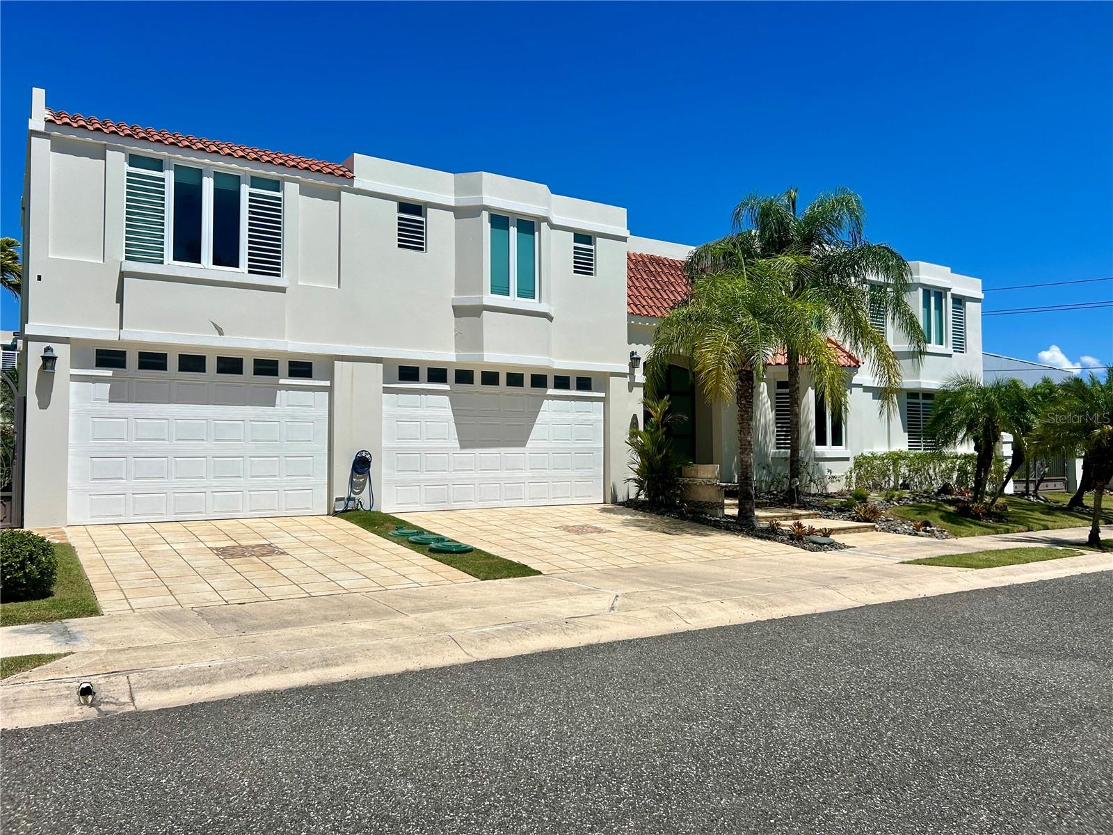 Expanded and remodeled home on a desirable corner lot, one of the largest in Paseos Los Corales II, offering 4,318 square feet of living space on an 851.69 square meter homesite. Designed with lifestyle in mind, the home features 5 bedrooms and 3.5 bathrooms along with multiple expanded living areas including a private home theater, two offices, a gym, and a billiard room. The outdoor spaces are equally impressive, boasting a swimming pool, jacuzzi, covered bar, and BBQ area, perfect for entertaining and family enjoyment. Additional enhancements include a gazebo, fenced yard, paved areas, a concrete roof terrace, and an enclosed second-floor terrace. Equipped with a full generator, cistern, and water softener, this home offers comfort and peace of mind. A three-car garage and oversized driveway complete this rare opportunity to own one of the most expansive and versatile homes in Paseos Los Corales II.