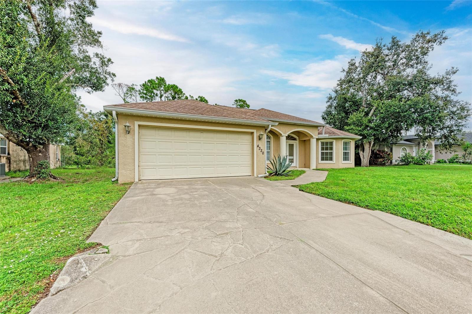 Great value in North Port! This spacious 3-bedroom, 2-bath, 2-car garage home sits on an oversized lot—nearly a quarter acre. Offering 1,841 square feet of living space, it’s ready for its next homeowner. While some cosmetic updates are needed, this property is priced to sell, giving buyers an incredible opportunity.
The split floor plan features a private master suite on one side and two generously sized guest rooms on the other. The kitchen is the heart of the home, framed by a roomy living area and dining space—perfect for both everyday living and entertaining. Step outside to a covered lanai where you can relax and enjoy peaceful mornings or evenings surrounded by mature landscaping.
Located in central North Port near the North Port Parks and Recreation Center and the Aquatic Center, top rated schools and lots of shopping. Easy access to 75fwy. Not in a flood zone, NO HOA, NO CDD.
