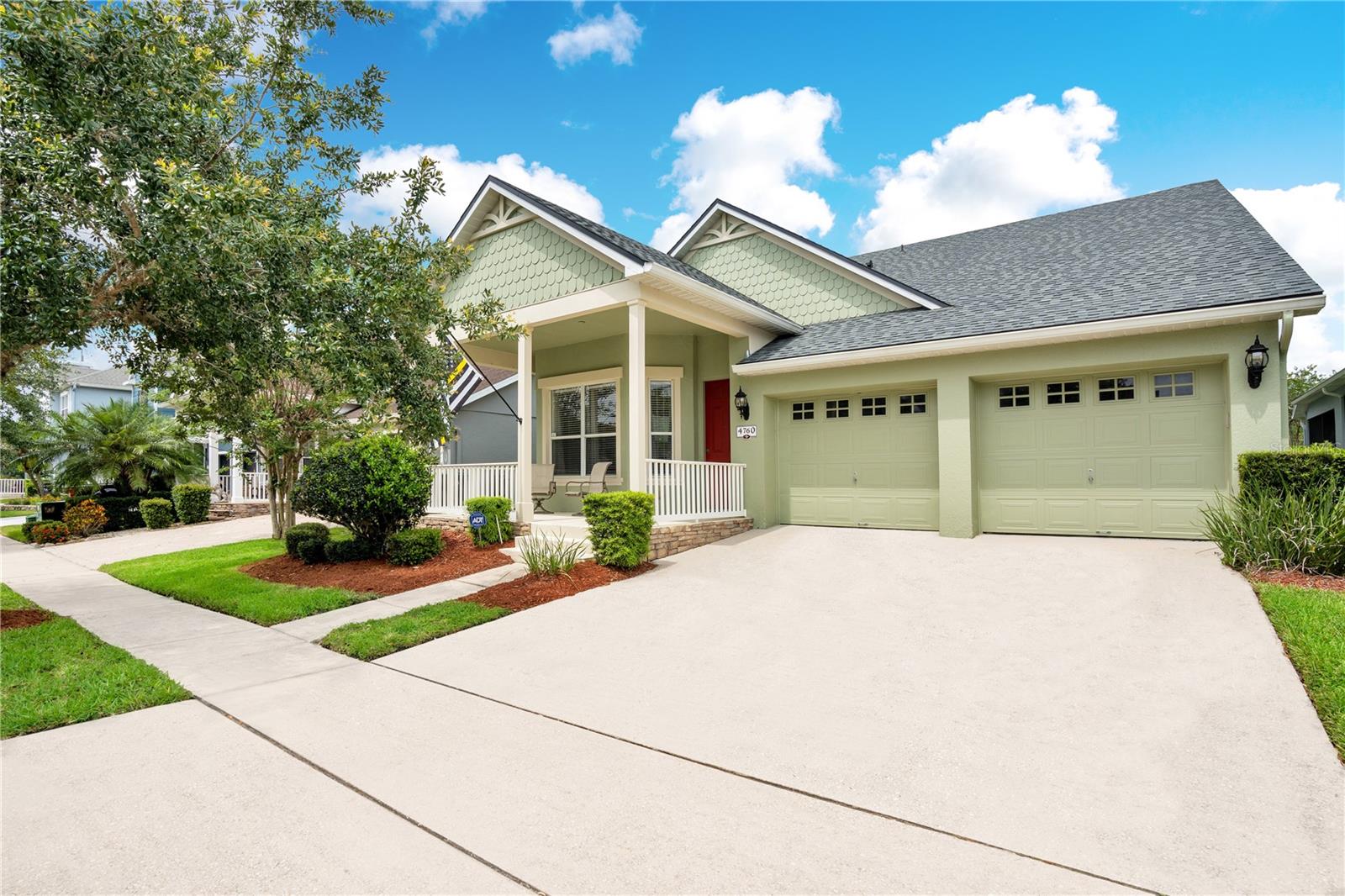 Nestled in the Avalon Park community, this water-view single-family home is ready for new homeowners. The tree-lined sidewalks, manicured landscaping, and upgraded hand-rolled exterior paint of this residence offers plenty of curb appeal. Make the most of the large front porch by adding a double-seated swing with plenty of cushions to make the perfect quiet place for reading a book. Step inside to warm wood flooring found throughout all the common areas, wood blinds on the windows, and a generous-sized flex room that could be used for a formal living or dining room, ideal for hosting large holiday gatherings. The recessed walls would be a great location to highlight your favorite artwork. The heart of the home lies in its open-concept kitchen, seamlessly connecting to the comfortable living area, which boasts stainless steel appliances, 42" cherry wood cabinetry, and an expansive breakfast bar with seating for five. The bright family room has calming water views and access to the screened-in lanai for alfresco dining. The master bedroom features a tray ceiling, a large walk-in closet, and an expansive en-suite with double sinks, a soaking tub, a walk-in shower, and a separate toilet room. Two additional sleeping quarters share another full-sized bathroom and easy access to the laundry room with direct access to the double-car garage. The fully fenced backyard makes the greenspace family and dog friendly. Because this lot backs up to a conservation area, you will have plenty of privacy as well. This home comes with exclusive access to amenities for the entire family to enjoy year-round including a splash pad, a playground, a fitness center with weights, treadmills, a yoga room, a sauna, a huge pool, a hot tub, basketball courts, an event space, and tennis courts. An array of shopping and dining options as well as easy access to the airport. Downtown Orlando is about 30 minutes to the West, with the Space Center & the beach less than an hour’s drive in the other direction. <div style="padding:56.25% 0 0 0;position:relative;"><iframe src="https://my.matterport.com/show/?m=FEN2f332Uny&mls=1" frameborder="0" allow="autoplay; fullscreen" allowfullscreen style="position:absolute;top:0;left:0;width:100%;height:100%;"></iframe></div>