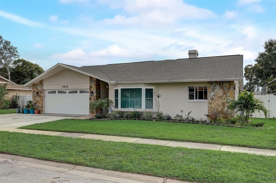 Check out the virtual tour! Come home to this one story 3,030 sqft residence with 5 bedrooms & 4 bathrooms PLUS A DEN or HOME OFFICE located 1 mile from Seminole High School! The open concept floor plan connects the dining room and living room with the recently updated kitchen (2021) allowing for easy conversation while cooking and entertaining. Nearby the family room opens to the lanai with new impact rated sliding glass doors (2022). Outside enjoy the spacious lanai surrounding the SALT WATER POOL. Let your dogs roam the fenced back yard and keep an extra vehicle parked in the expanded driveway. The 2 car garage has a recently installed impact rated garage door (2022). Located in Flood Zone "X", so no flood insurance is required, yet this home is a less than 10 minute drive to the beaches! No HOA & located inside UNINCORPORATED Pinellas County. Zoned for Seminole High School, Seminole Middle School and Oakhurst  Elementary School. RECENT UPDATES INCLUDE: shingle roof (2020), A/C ducting resealed (2022), new R38 attic insulation (2021), resurfaced pool (2022), new lanai & pool deck pavers (2022), new gutters (2020), new garage door opener (2020), impact rated sliding glass door in the primary bedroom leading to the lanai (2022), and waterproof vinyl flooring in the main living areas (2020). Well water irrigation system. Ready to be your forever home!