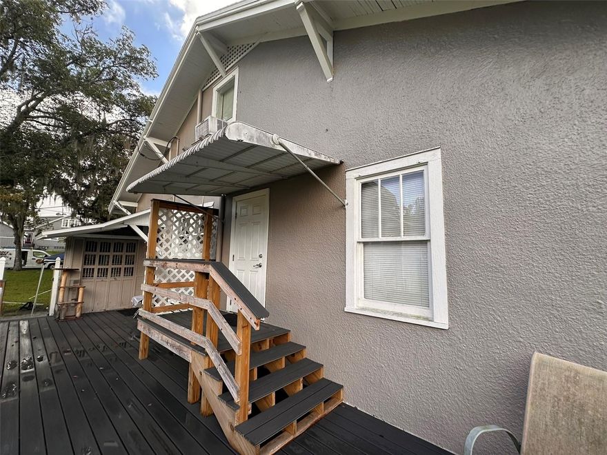 Charming attic apartment conveniently located near downtown DeLand! This cozy efficiency-style unit offers an open living area that combines the bedroom, living, and kitchenette spaces for simple, comfortable living. The kitchenette includes a small refrigerator, microwave, and portable cooktop, and the bathroom features a stand-up shower. Access is from the rear deck via a set of steep interior stairs. Rent includes utilities. Renters insurance is required. Ideal for someone seeking an affordable and convenient space close to local shops, dining, and entertainment in historic downtown DeLand.