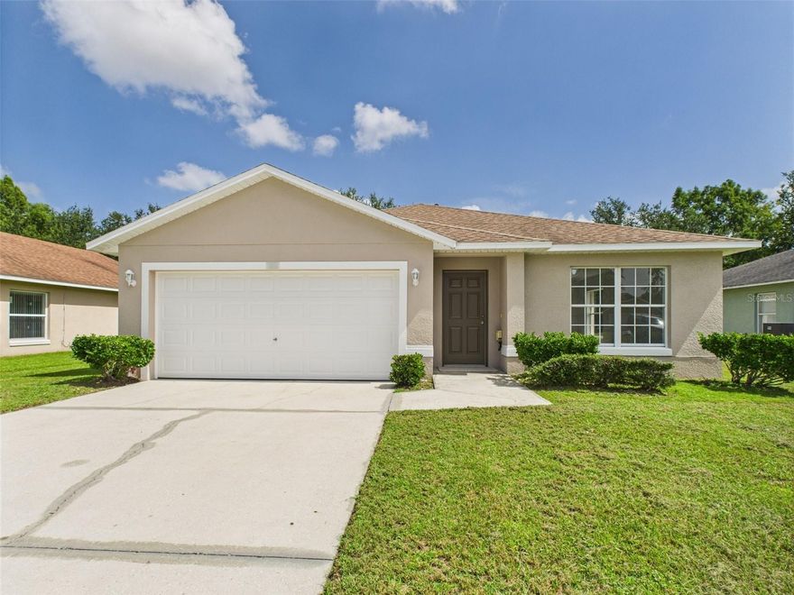 NEWLY RENOVATED! Welcome to this beautifully updated 3 bedroom, 2 bathroom home with 1,438+ sq. ft. of comfortable living space, perfectly situated in a peaceful Ocoee neighborhood. Built in 2009 and freshly renovated, this move-in-ready home features bright white freshly painted walls and brand-new carpet flooring, giving the interior a crisp, modern feel. The bright, open floor plan flows effortlessly, offering stylish comfort and worry-free living for its next owners. The upgraded kitchen boasts stainless steel appliances, a pantry with shelving for easy access, and an eat-in kitchen counter, perfect for casual dining and meal prep. Step outside to enjoy a beautiful retention pond and a private green backyard with no rear neighbors and no road behind the property...just lush trees for peace of mind and quiet living. Breathtaking lake views, a spacious covered porch ideal for outdoor entertaining, and a 2-car attached garage with ample space for parking, a workshop, and storage complete the picture. Located less than a 10-minute drive from nearby Lake Apopka, this home offers easy access to one of Central Florida’s premier outdoor destinations. The primary suite offers a relaxing retreat with an updated ensuite bath, while two additional bedrooms provide flexibility for guests, family, or a home office. Thoughtful landscaping enhances the curb appeal, creating an inviting first impression. With no HOA, you’ll have the freedom to truly make this home your own. Conveniently located near schools, shopping, dining, and major highways, this property blends tranquility with accessibility. Seller financing and private financing available. Don't miss this newly renovated gem!