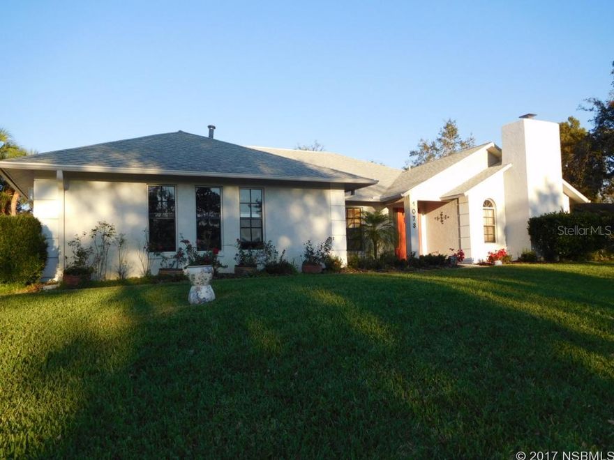 Spectacular modern home in Sugar Mill Country Club situated on a very high lot to feel the breeze! Magnificent 3BR/2BA block/stucco home features an open floor plan, expansive cathedral ceilings, arched doorways, tile & wood laminate floors & security system. Lots of potential rooms & space for dining areas, music rooms, piano, studio, office, exercise room, etc. Front den/office has a cozy gas fireplace & the formal dining room area leads to the kitchen with tons of cabinets, pantry, newer gas stove & other appliances. Watch the birds & squirrels from walls of glass windows & lush landscaping which surround the rear family room. Huge 2 car garage has pull down attic stairs, workshop area, central vac, washer/dryer & shelving. Gas stove, water heater, fireplace & heat help keep the utility bills very low. The Sugar Mill Country Club & Golf course has several membership plans available, including use of the 27 hole golf course, 3 restaurants, pro shop & locker room, fitness center, tennis courts, pool & more. All of this, and only 45 minutes to Orlando & 10 minutes to the fabulous sandy white beaches of New Smyrna Beach! See sellers disclosure for more details of this fabulous home! ;Water: City