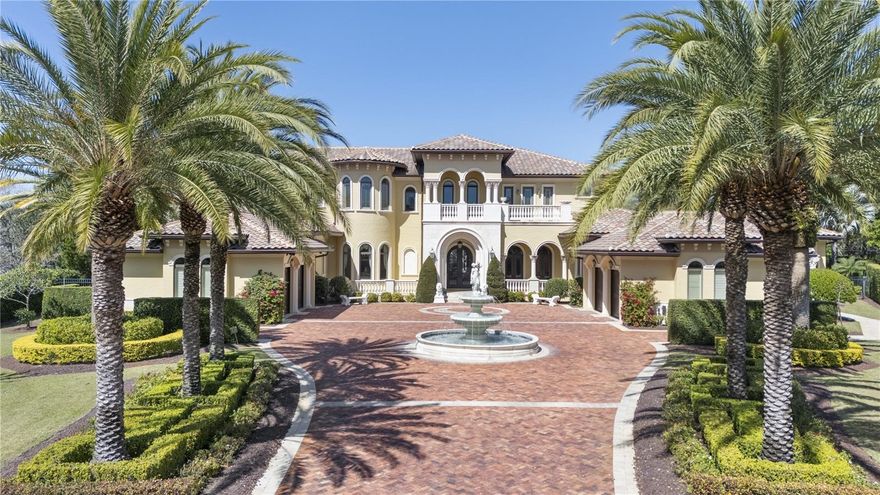 Nestled within a prestigious gated community in the heart of Windermere, this extraordinary estate offers the ultimate in luxury living. The property includes a 1,500 sq ft separate guest house complete with a  kitchen, bedroom, and living space, making it perfect for multigenerational families or hosting visitors.  The gourmet kitchen is truly a chef's dream, featuring a Viking gas stove, pot filler, carved marble farmhouse sink, Viking refrigerator/freezer, granite countertops, refrigerator drawers, two dishwashers, and a built-in espresso machine. Additional amenities include a wine cellar, mini bar, butler's pantry, and a sauna.  For added convenience, an elevator provides access to the upstairs game room and separate media room.  The expansive upstairs balconies offer breathtaking views of the meticulously designed outdoor entertainment area, which boasts travertine tile and surround sound. This space includes a large bar and grill, gas fireplace, gas fire pits/balls, and a pergola with a trellis waterfall, all surrounding a stunning 51x25 ft salt-water pool and spa.   The Primary suite is a true retreat, complete with a 15x14 exercise room and an 18x16 office featuring custom-built, wall-to-wall cabinetry. The entire first floor is adorned with travertine flooring and decorative frescoes, adding to the home's elegance. The dramatic living room, with 27-foot ceilings and a wall of glass, offers sweeping views of the pool area.  The home also features a downstairs guest suite and each of the upstairs bedrooms is equipped with its own walk-in closet and en suite bath, and features private balconies both at the front and rear of the home. The estate also includes a comprehensive sound and security system, featuring a whole-home monitoring system with cameras and separate control rooms for added peace of mind.  The property offers a four-car garage (2+2 configuration) and a vast paver driveway, complete with a fountain illuminated by multi-colored lights, all located at the end of a serene cul-de-sac.