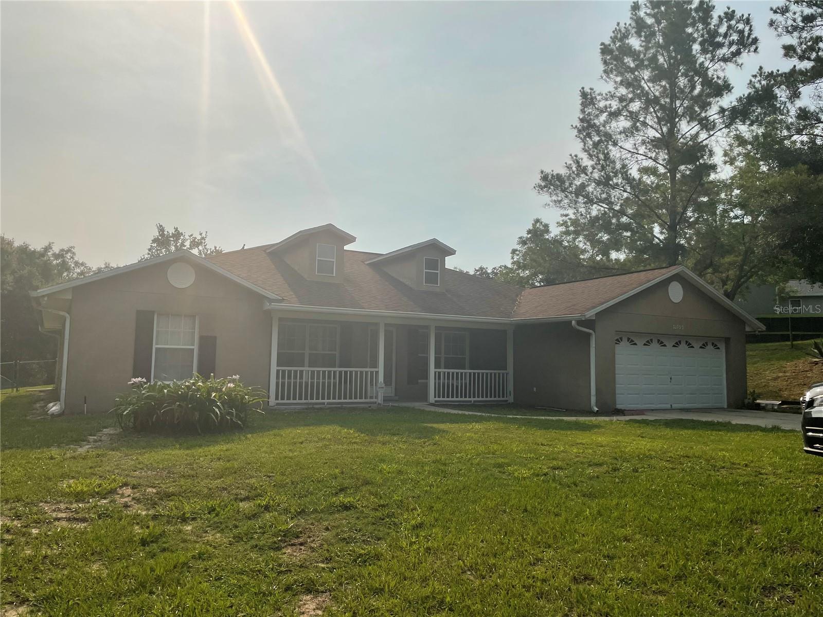 RENT This private oasis in a wonderful small rural neighborhood setting! Yet close to everything (SR46, 429, 441), 6 minutes to Downtown Mount Dora, 45 minutes to Disney and 30 minutes to Orlando. This spacious 2224 sq. ft., 3-bedroom, 2-bathroom home sits on over an acre at the end of a peaceful cul-de-sac, offering the freedom of no HOA restrictions. You'll love the recent upgrades, including roof, air conditioner, and modern kitchen appliances featuring a microwave convection oven. Enjoy the Florida lifestyle with a screened, solar-heated pool and spa, perfect for year-round enjoyment. Inside, this home boasts formal living and dining rooms, a cozy gas fireplace in the family room, a charming kitchen nook, his and her closets, and a convenient indoor laundry room. The Kitchen Island is ideal for entertaining guests. With well and septic systems in place, you'll benefit from no water or trash bills. Plus, with over an acre of space, you can bring your farm animals or park your RV in the backyard (subject to Lake County ordinances regarding permissible types, quantities, and parking specifics)